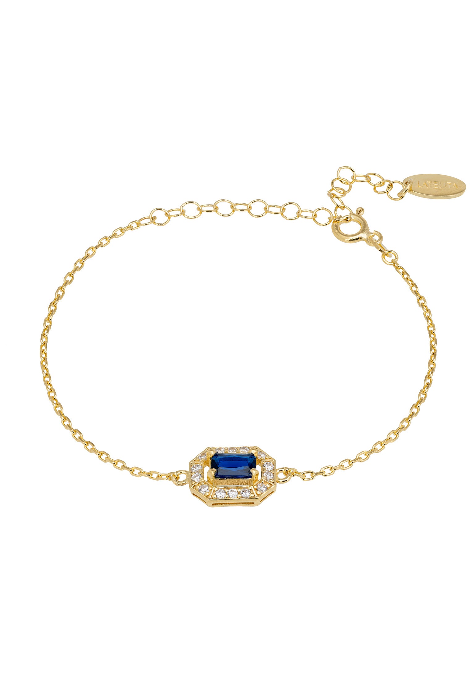 Gold bracelet with a blue gemstone on a white background