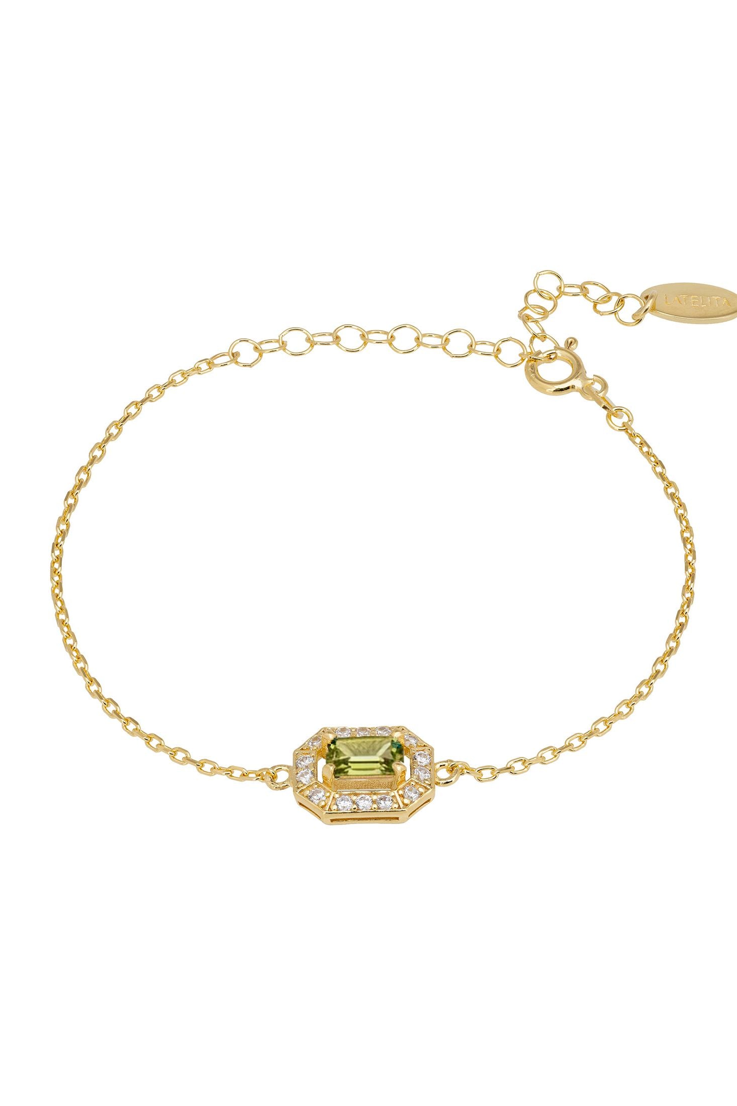 Gold bracelet with a green gemstone on a white background