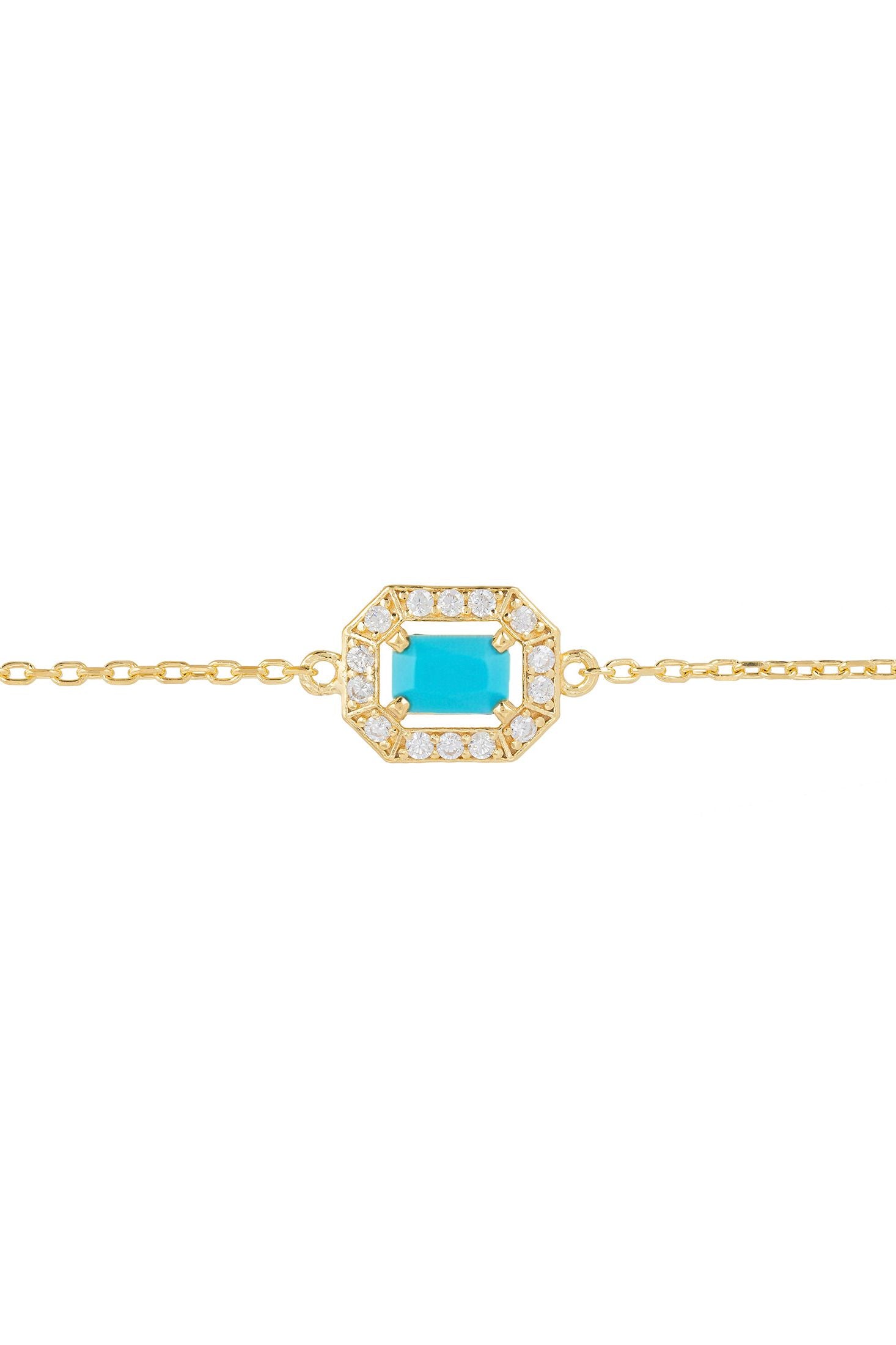 Gold bracelet with a turquoise stone and diamond accents on a white background