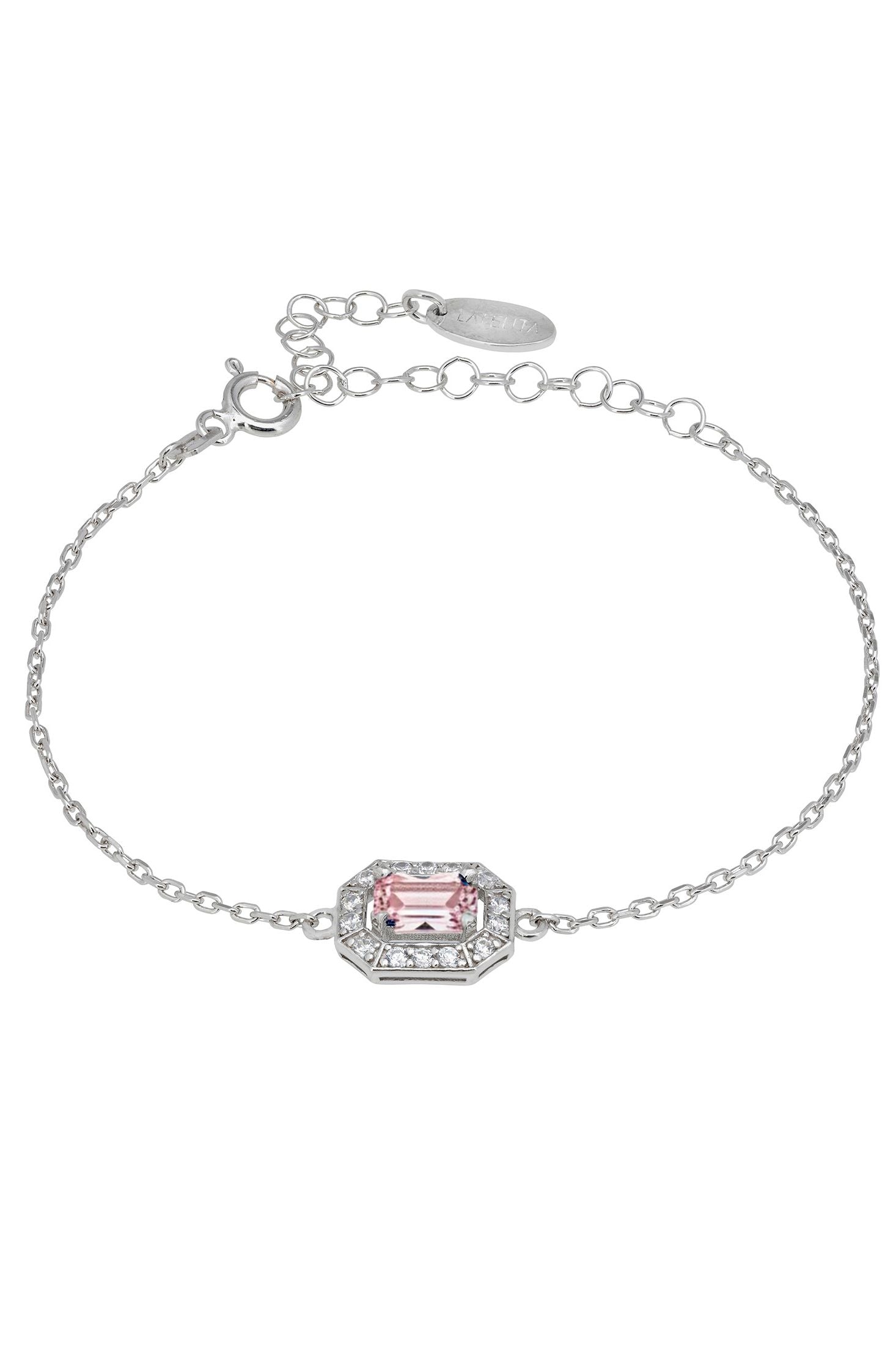 Silver bracelet with a pink gemstone on a white background