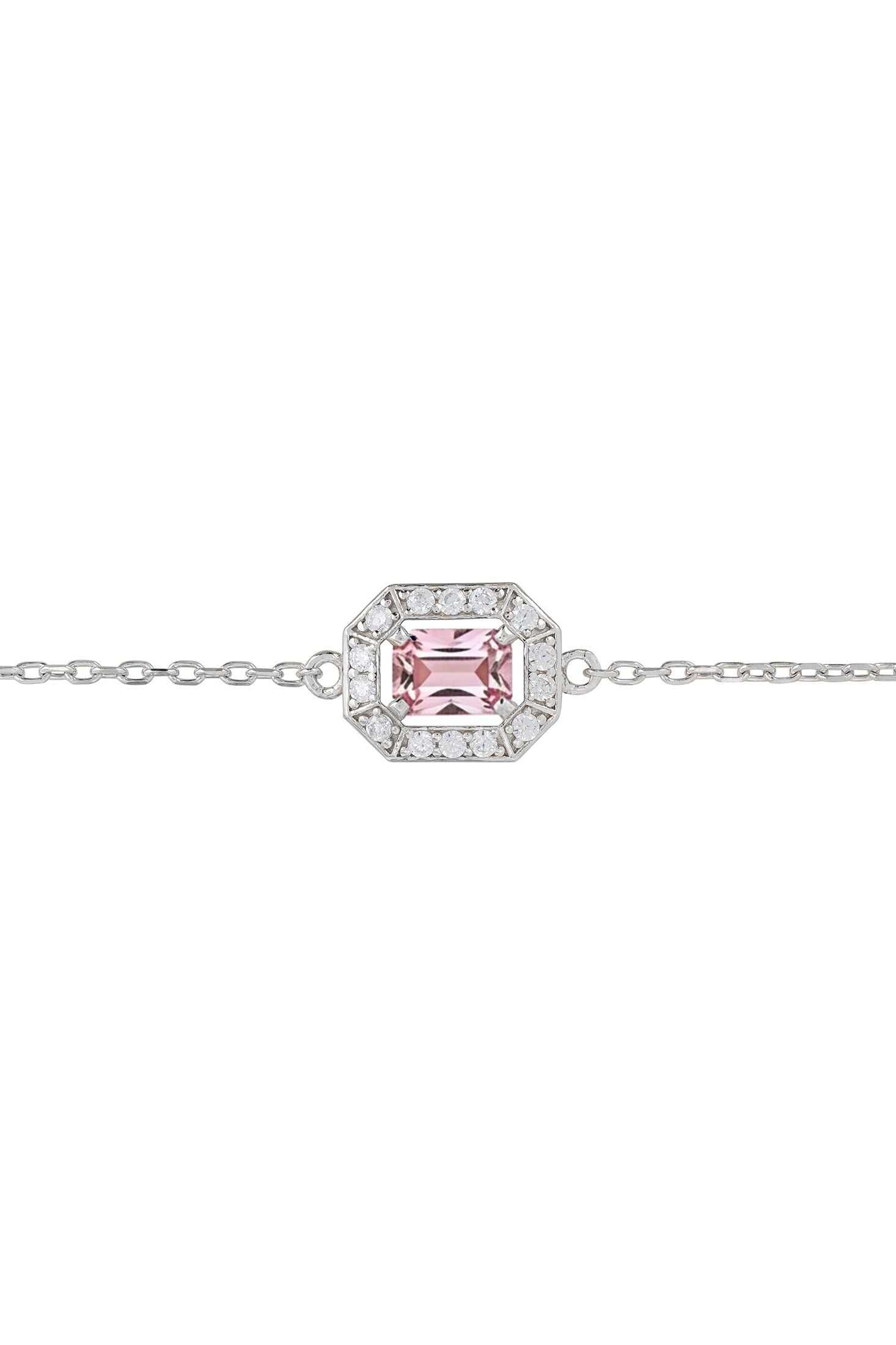 Silver bracelet with a pink gemstone on a white background