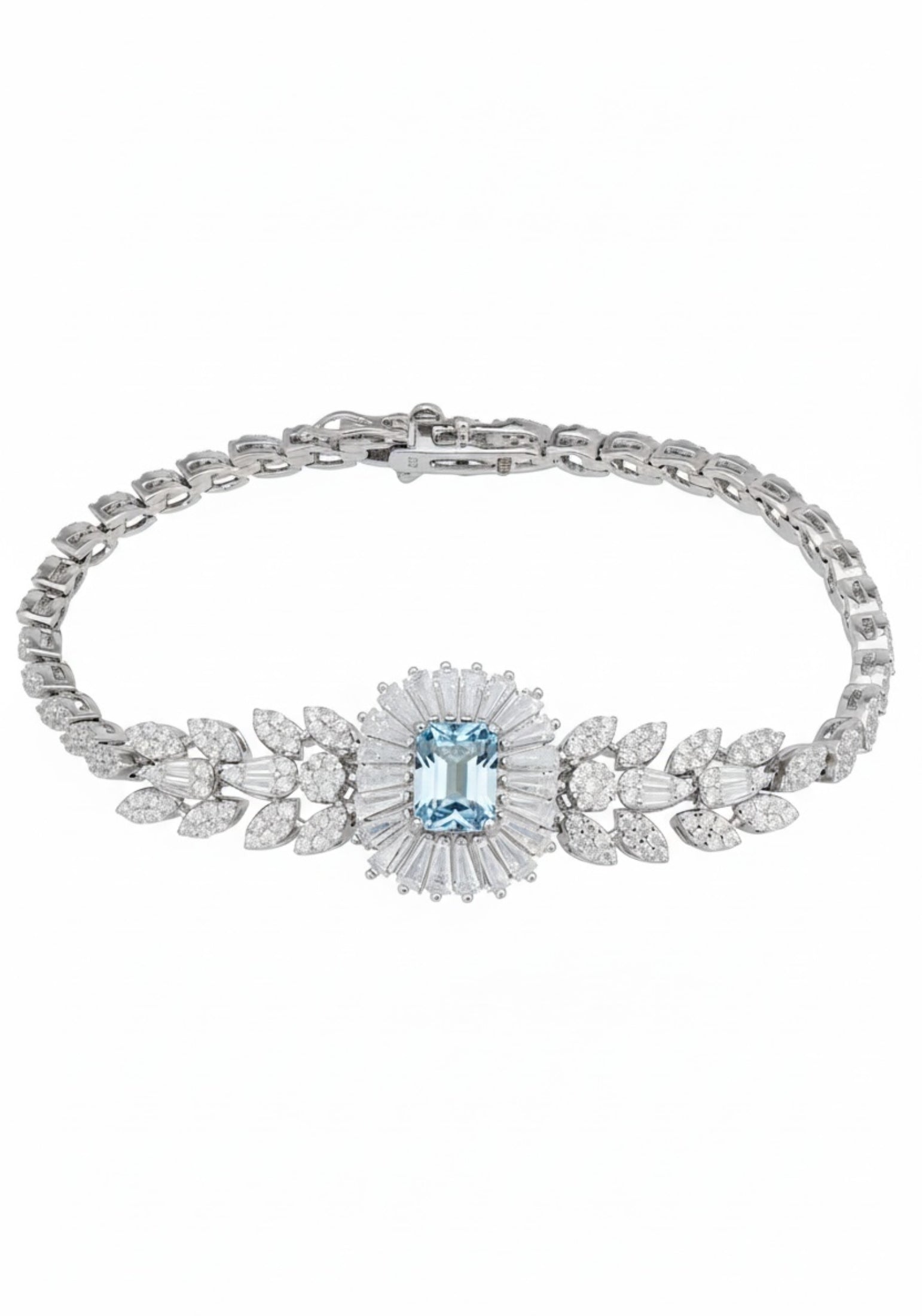 Silver bracelet with a central blue gemstone and floral design on a white background