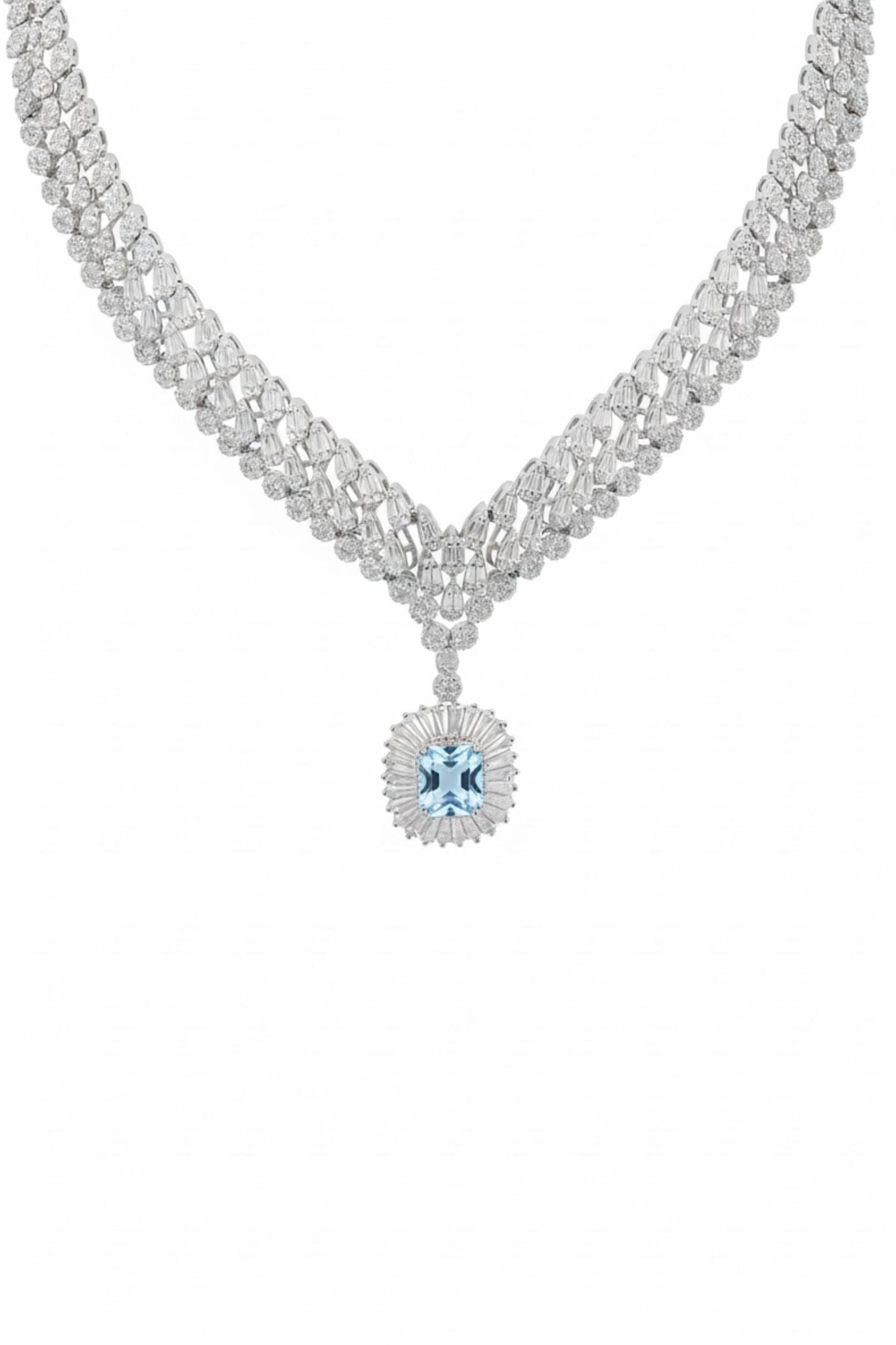 Delicate necklace with a central blue gemstone on a white background