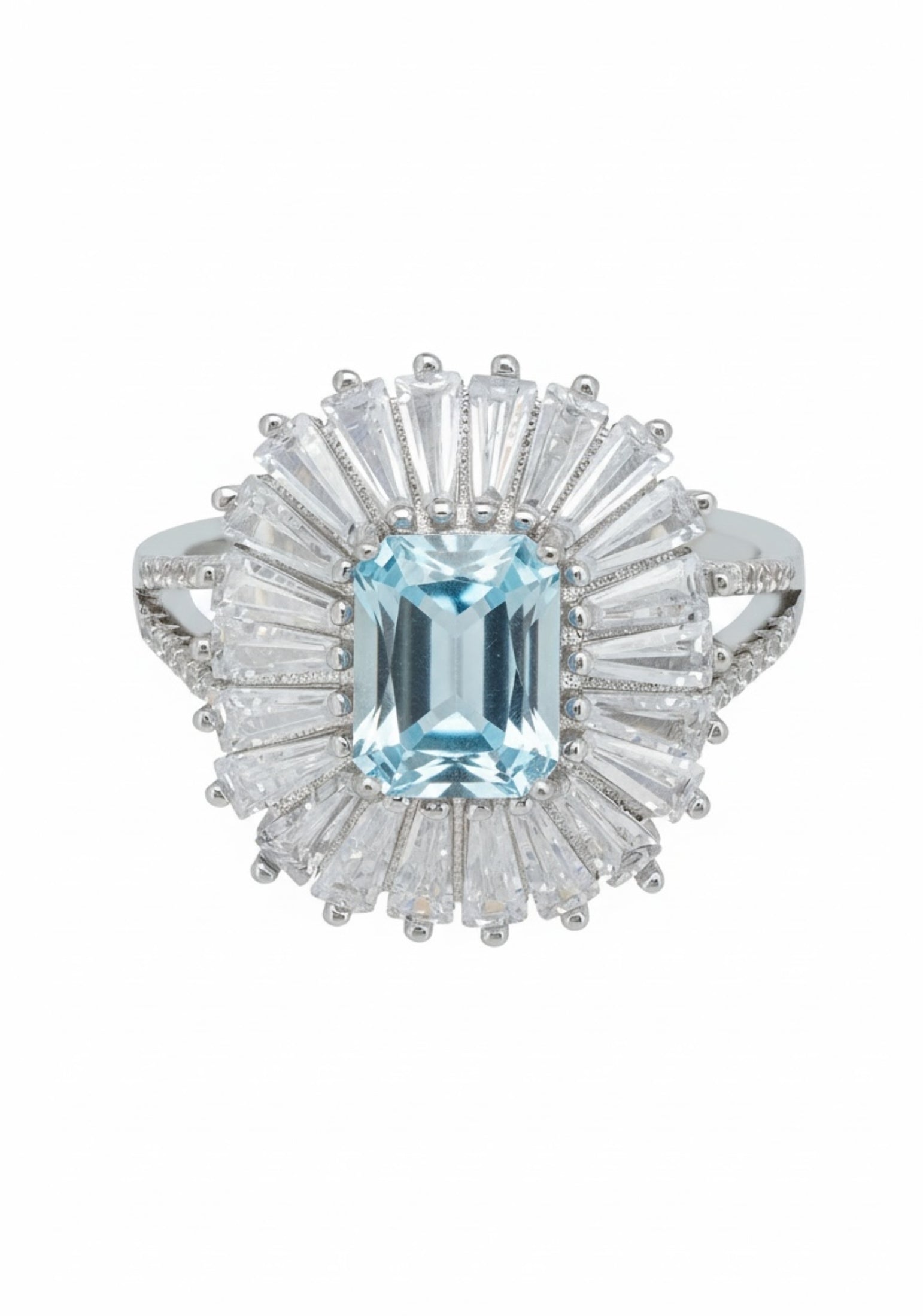 Ring with a central blue gemstone and diamond-studded halo on a white background