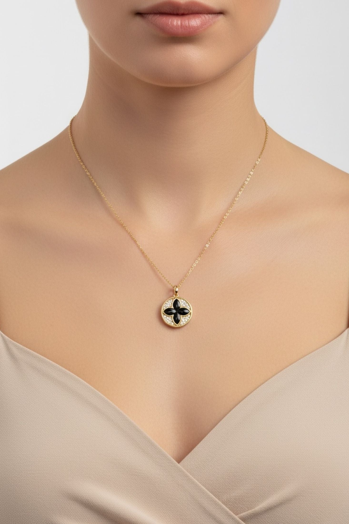 Necklace with a pendant worn by a model on a neutral background