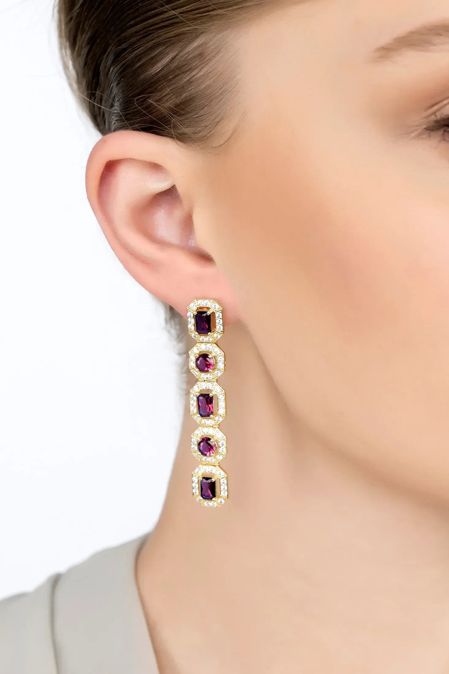 The earring worn by a model.