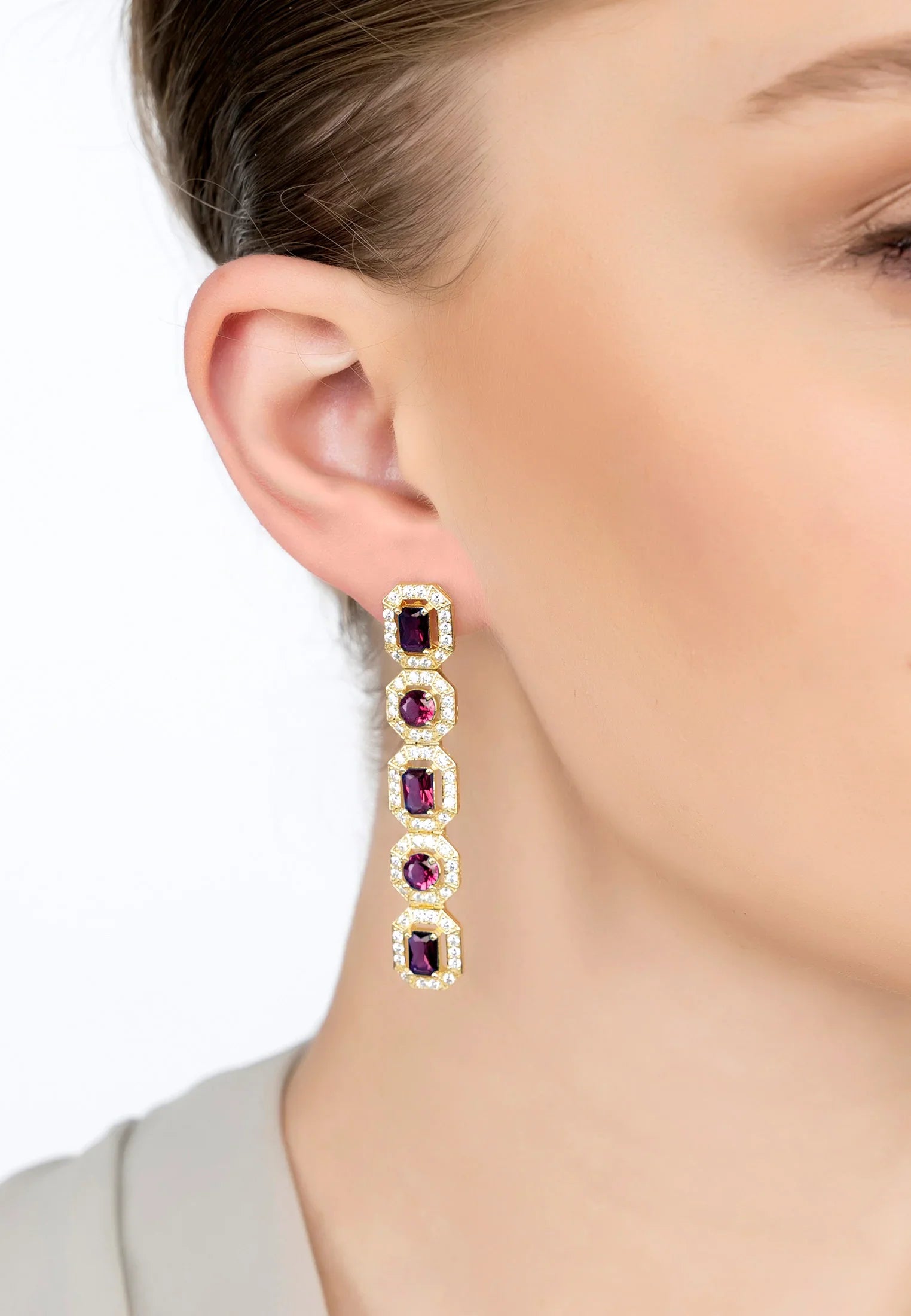 The earring worn by a model.