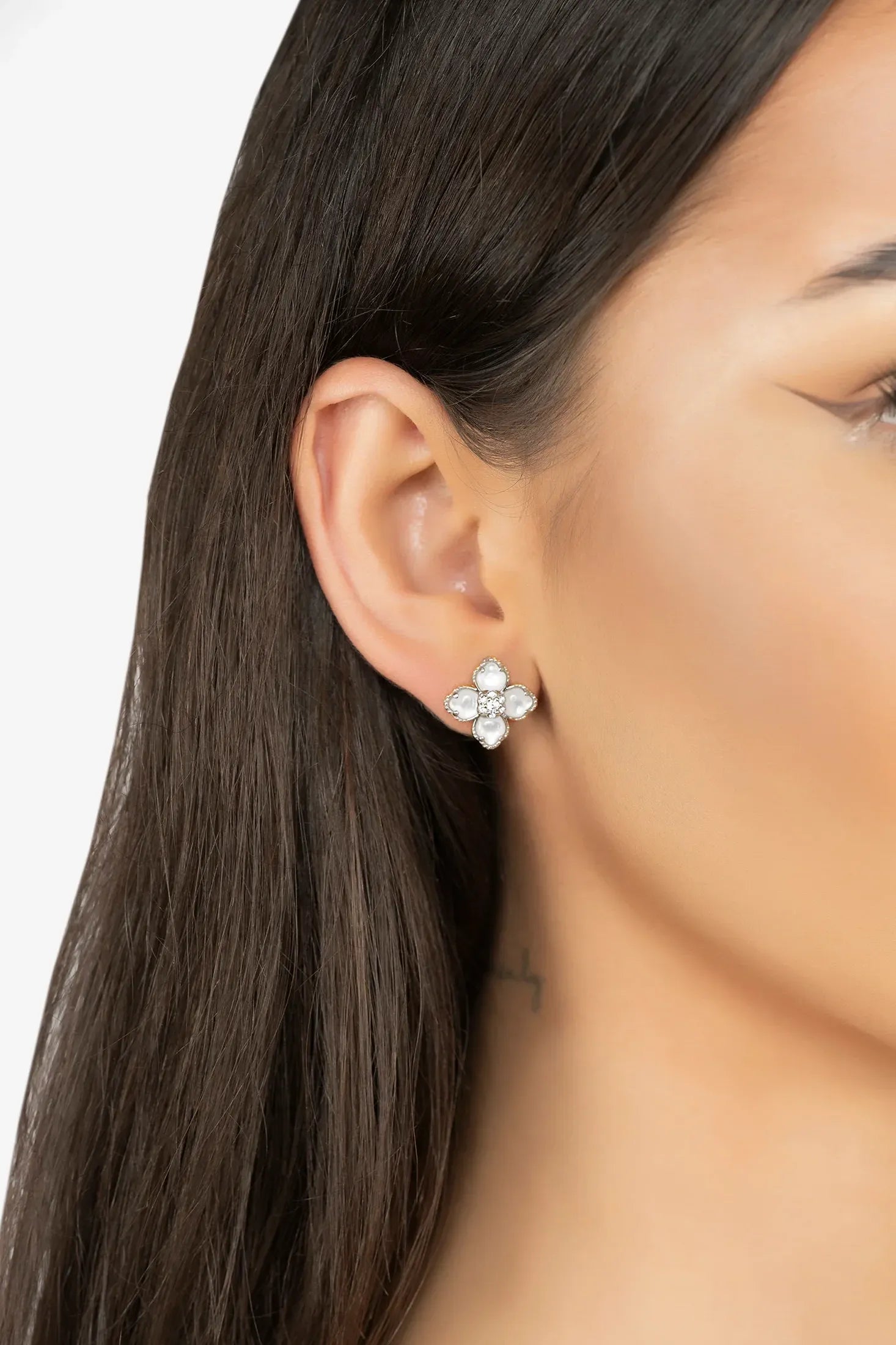 The earring worn by a model.