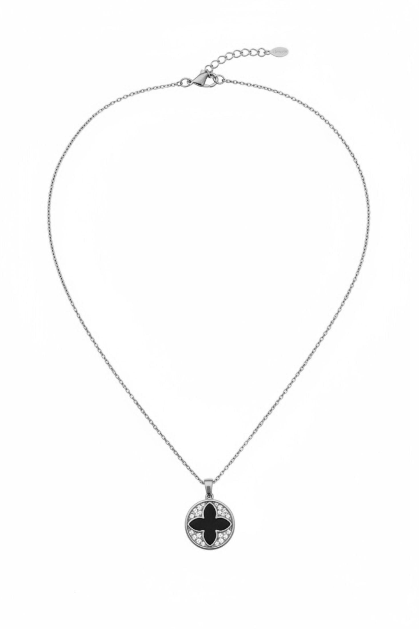 Necklace with a round pendant featuring black and silver design on a white background