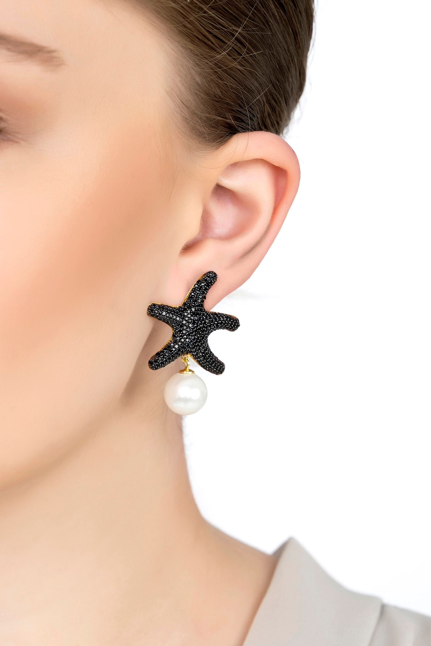 The earring worn by a model.