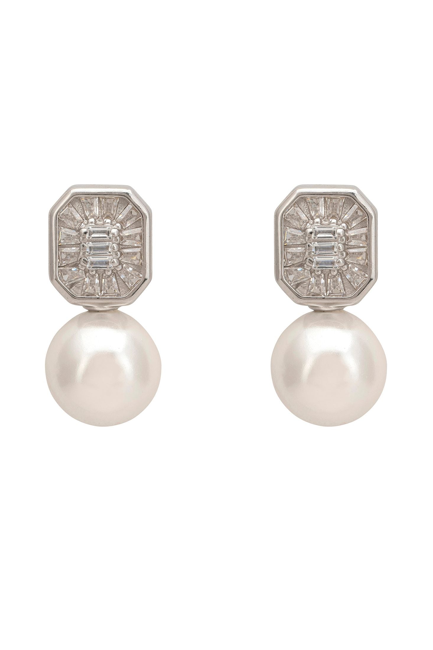 Pair of earrings with pearl drops and silver geometric tops on a white background
