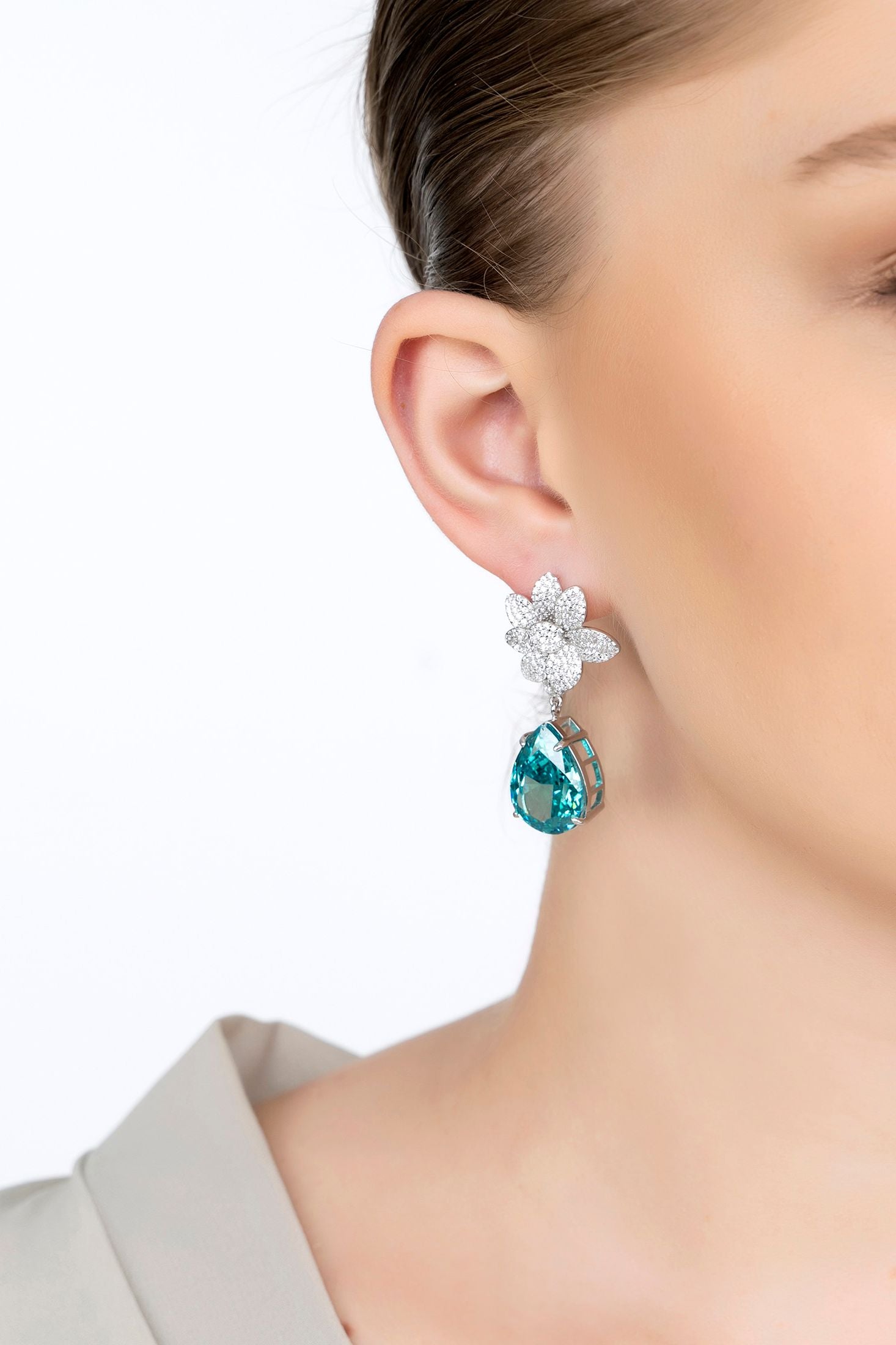 The earring worn by a model.
