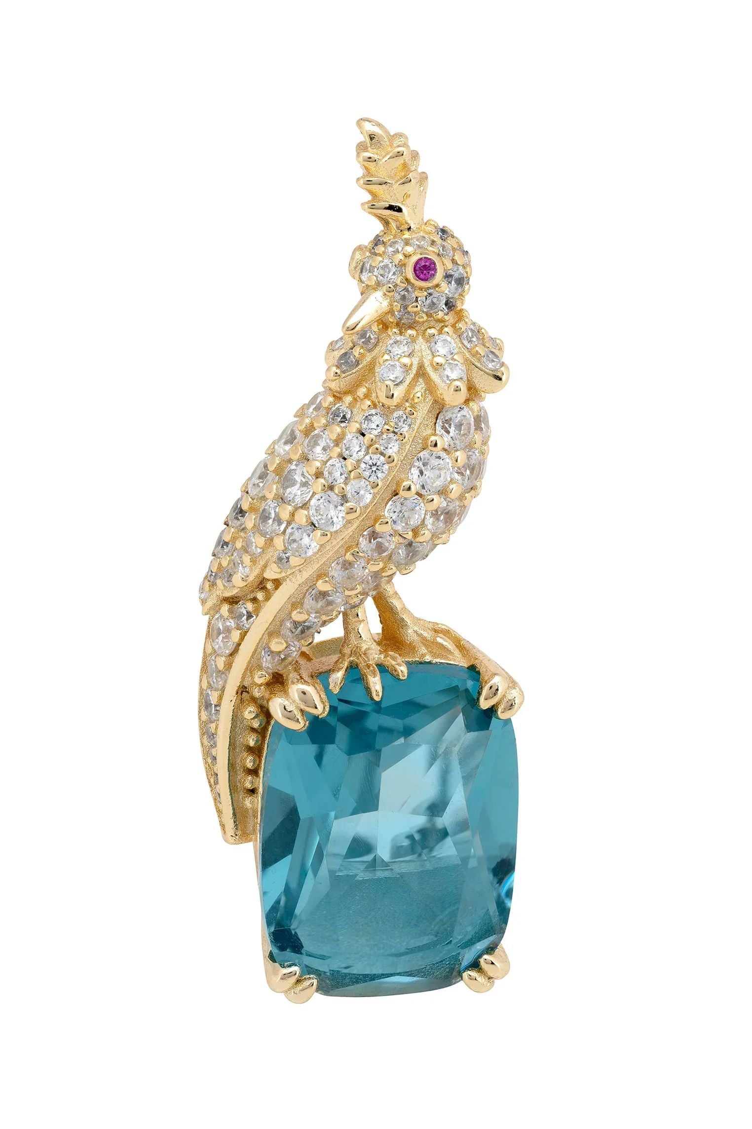 Brooch of a diamond and gold bird perched on a blue gemstone.