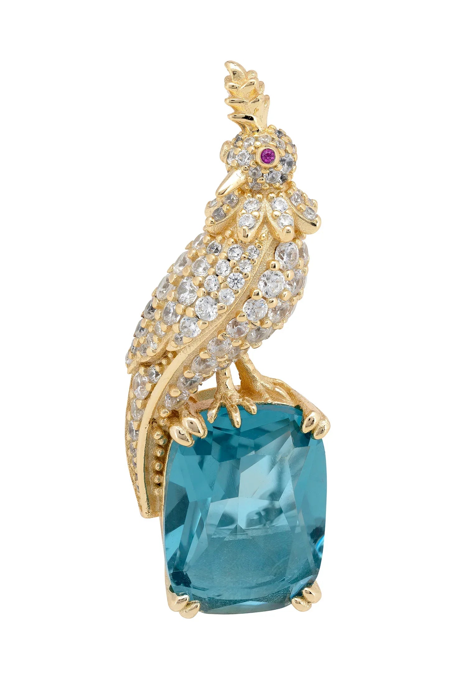 Brooch of a diamond and gold bird perched on a blue gemstone.