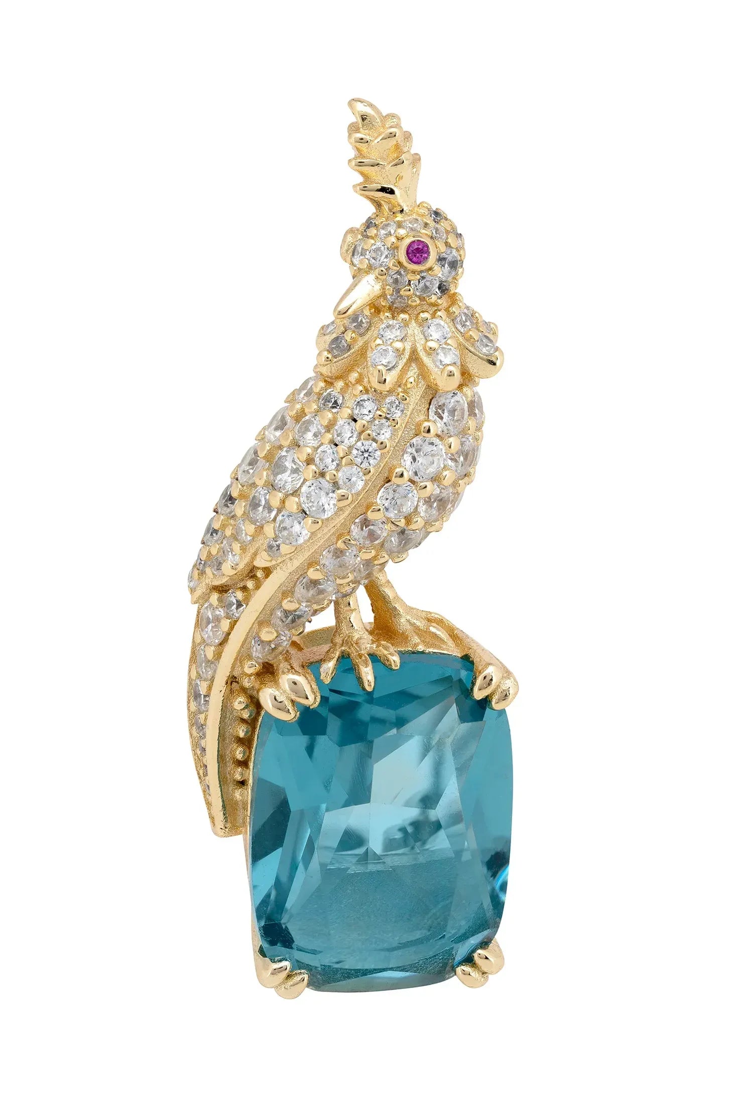 Brooch of a diamond and gold bird perched on a blue gemstone.