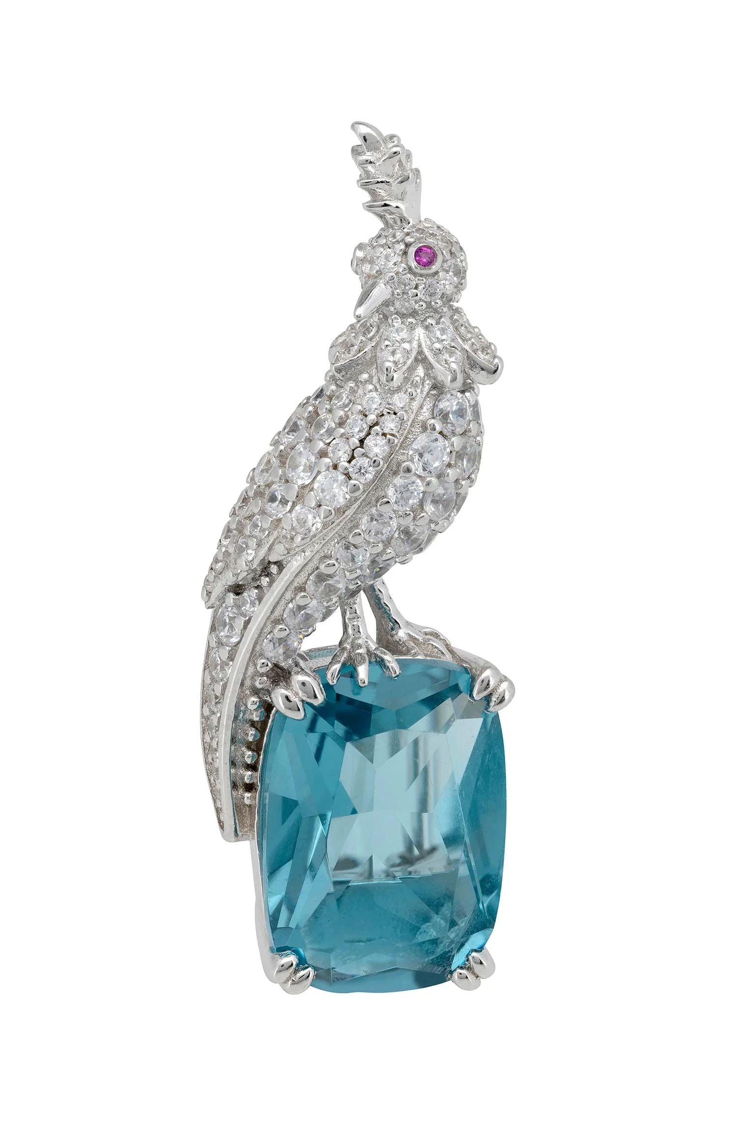 Brooch of a diamond bird perched on a blue gemstone.