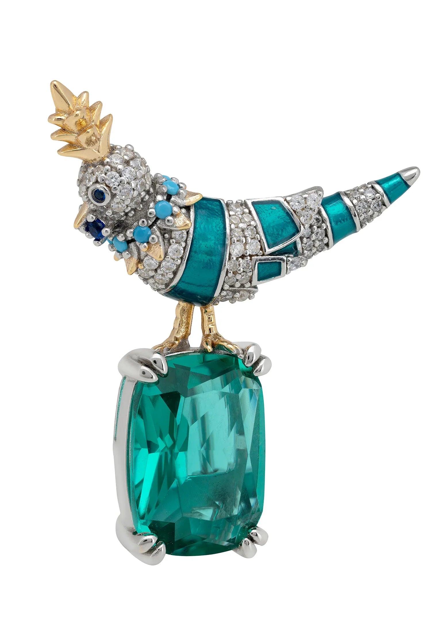 Brooch of a colorful bird perched on an emerald.