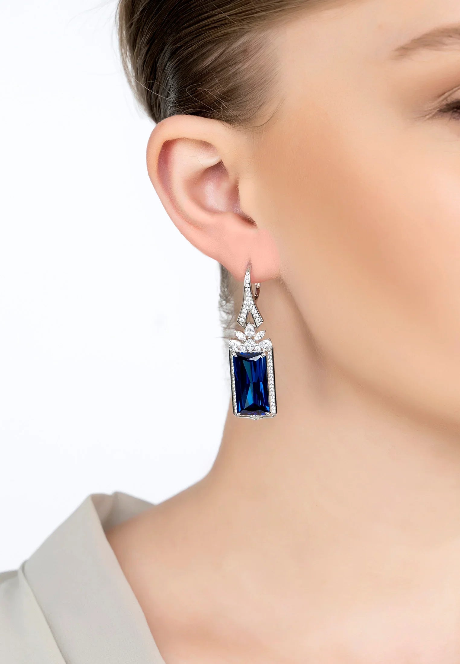 The earring worn by a model.