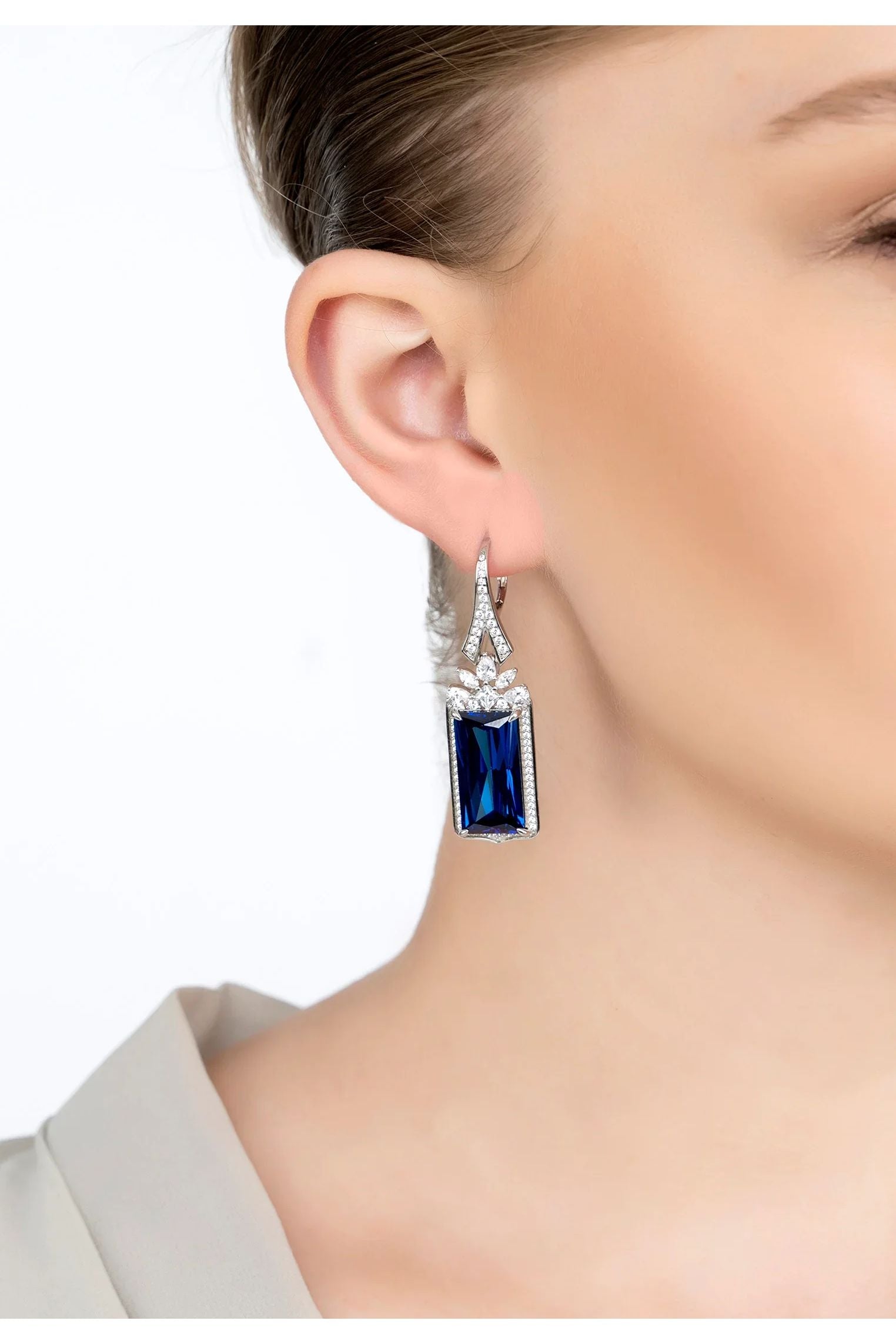 The earring worn by a model.