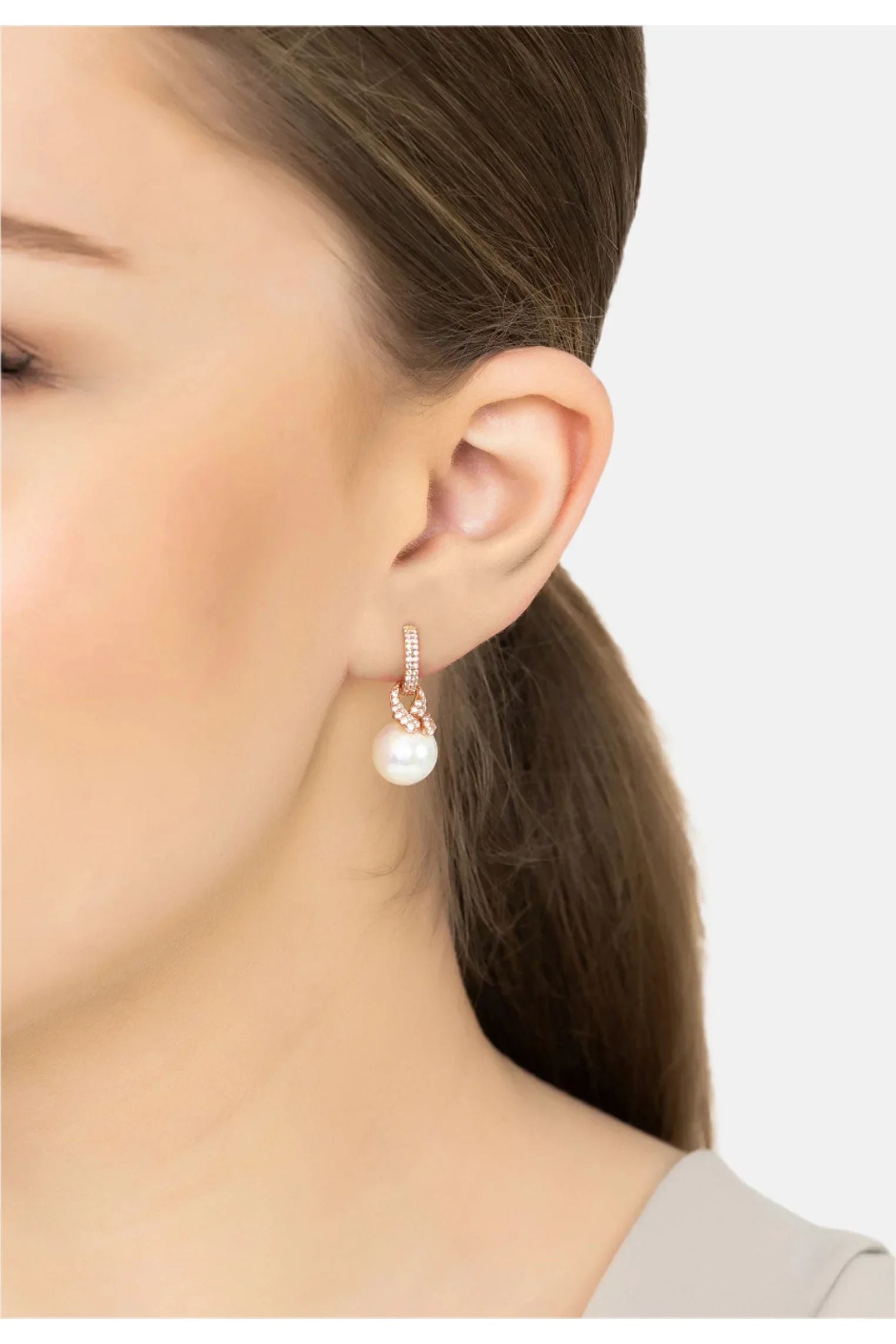 The earring worn by a model.