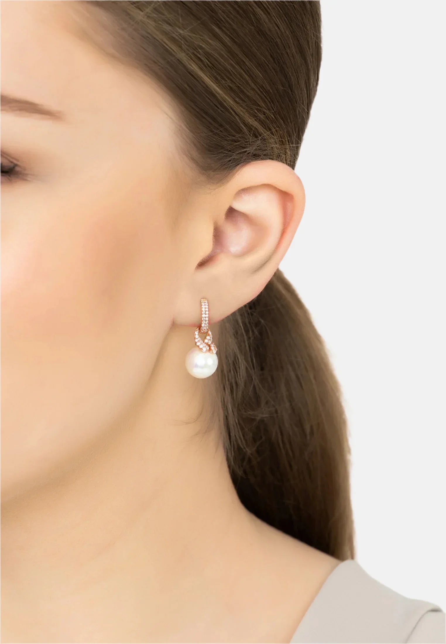 The earring worn by a model.