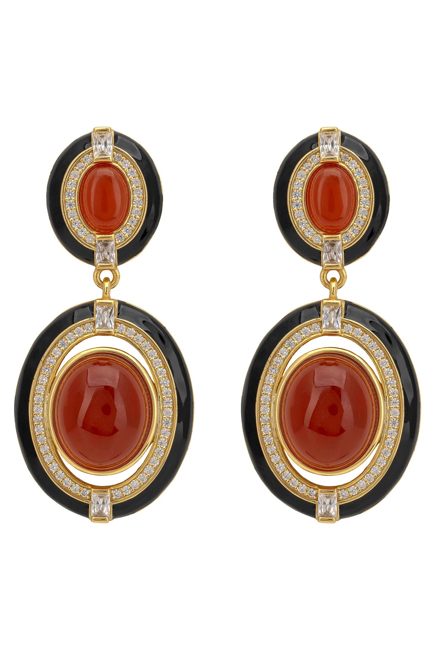Pair of earrings with red stones and gold accents on a white background