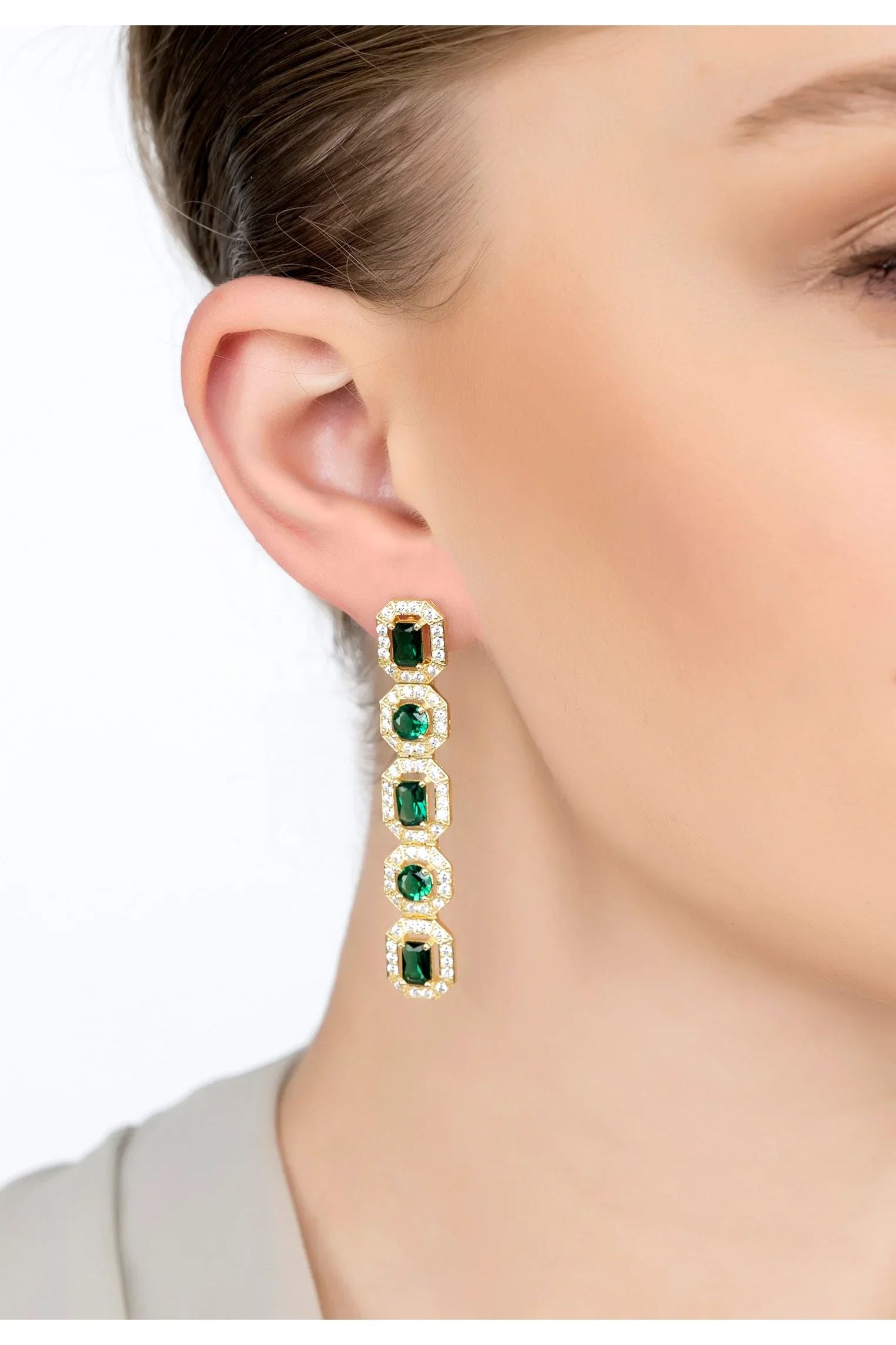 The earring worn by a model.