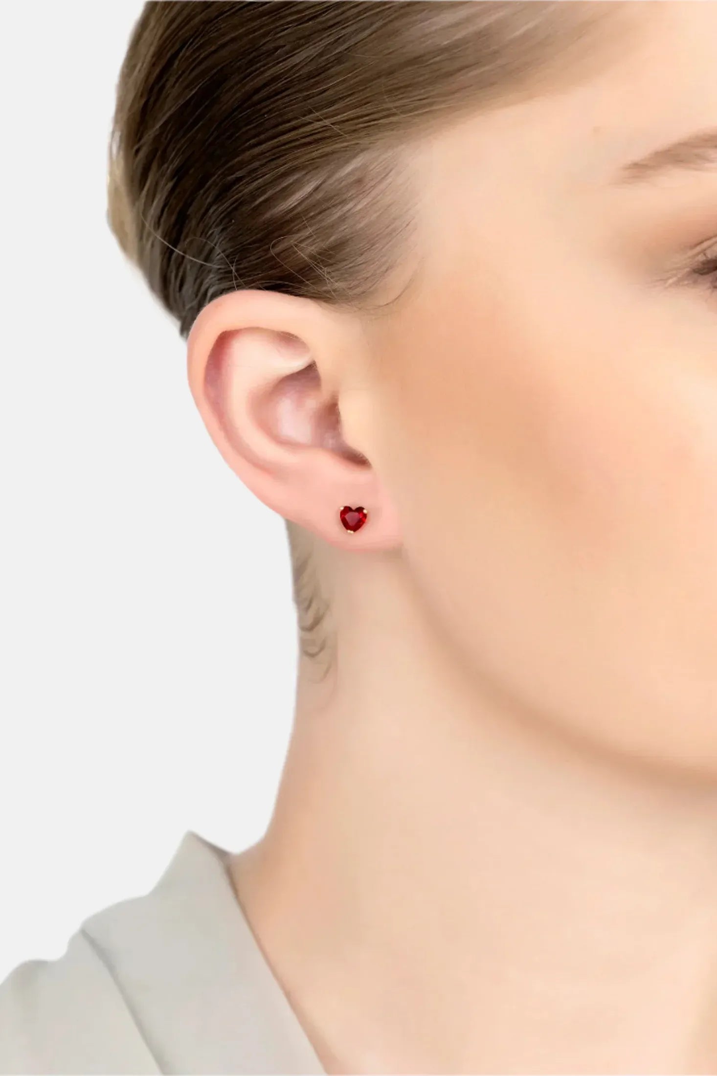 The earring worn by a model.