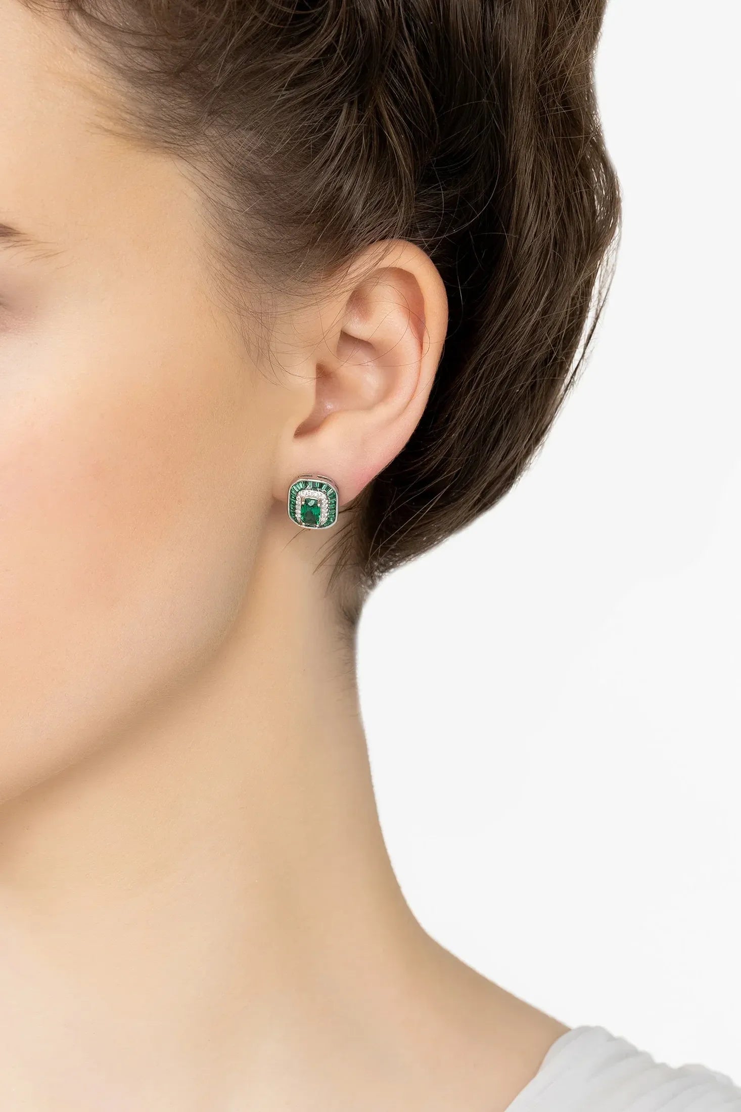 Angled view of Great Gatsby Stud Earrings Emerald Silver, showing emerald detailing, silver finish and the jewellery profile.