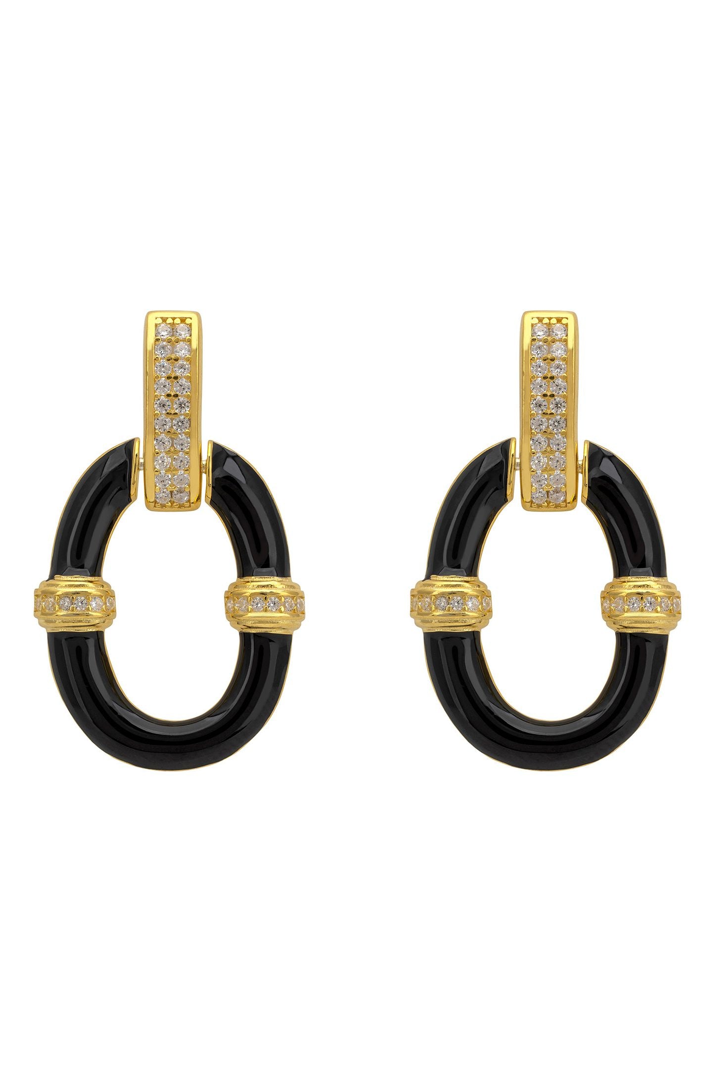 Pair of earrings with black circular design and gold accents on a white background