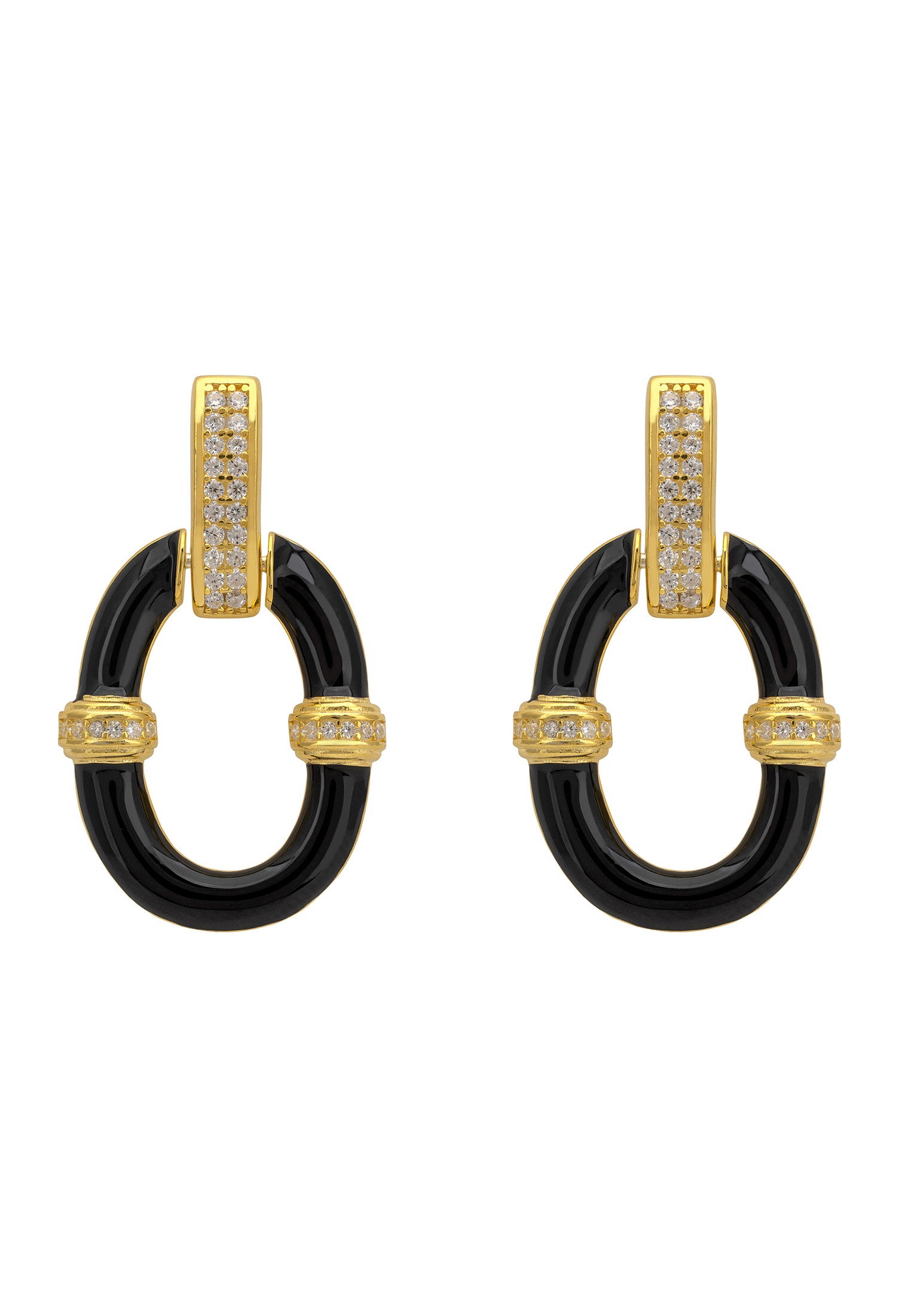 Pair of earrings with black circular design and gold accents on a white background