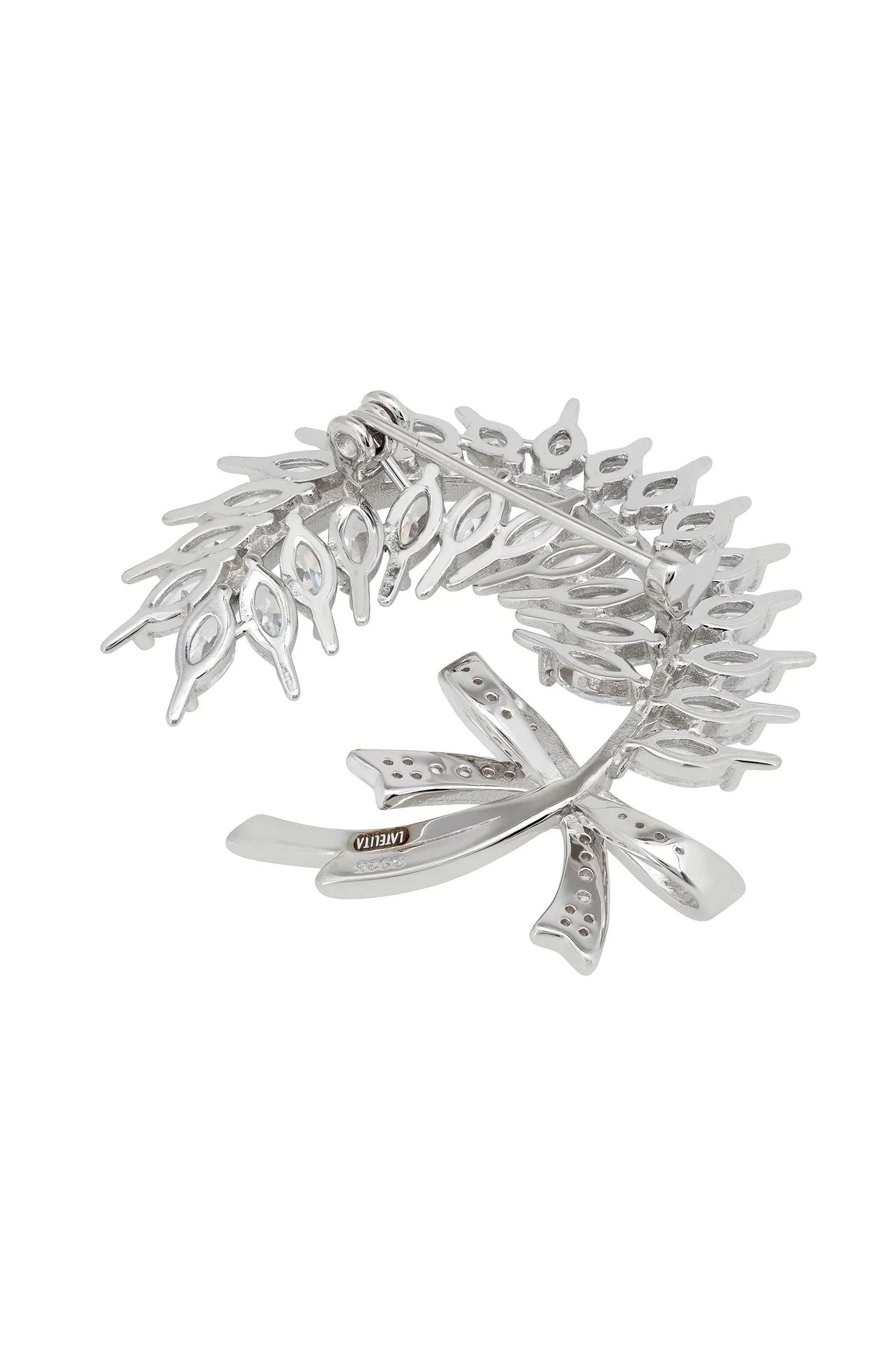 Silver pin back of the brooch.