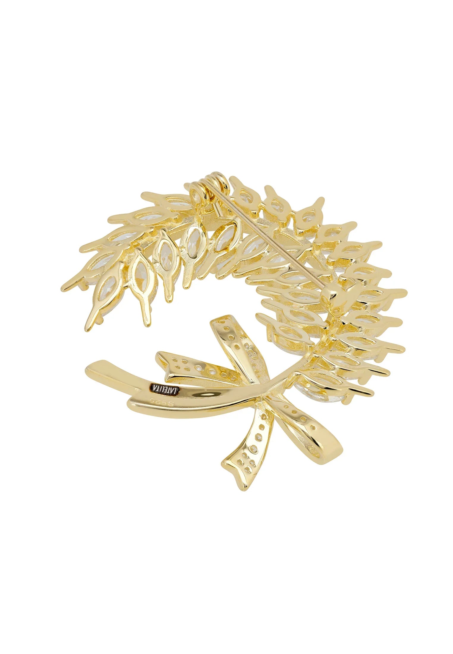 Gold pin back of the brooch.