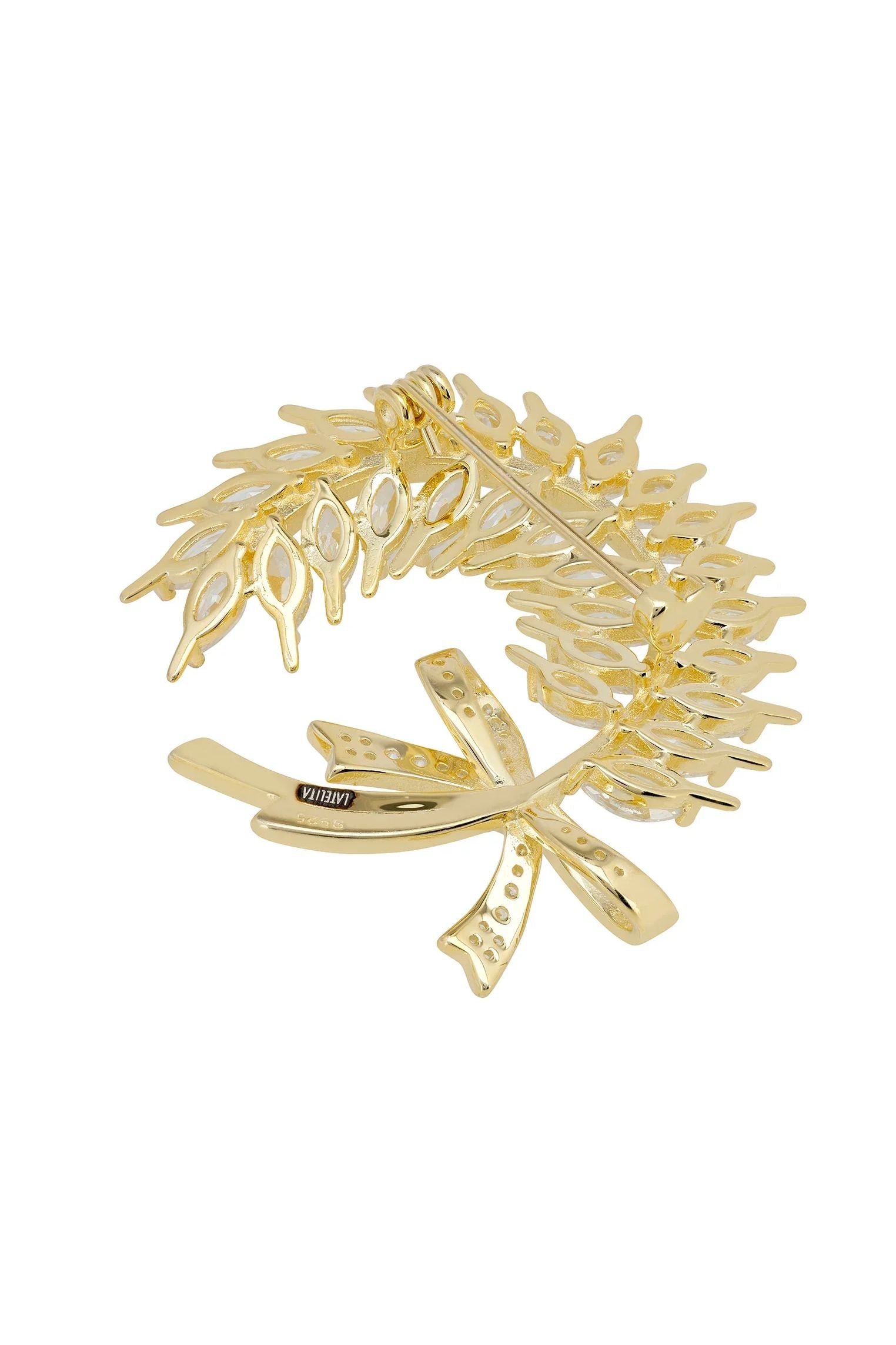 Gold pin back of the brooch.