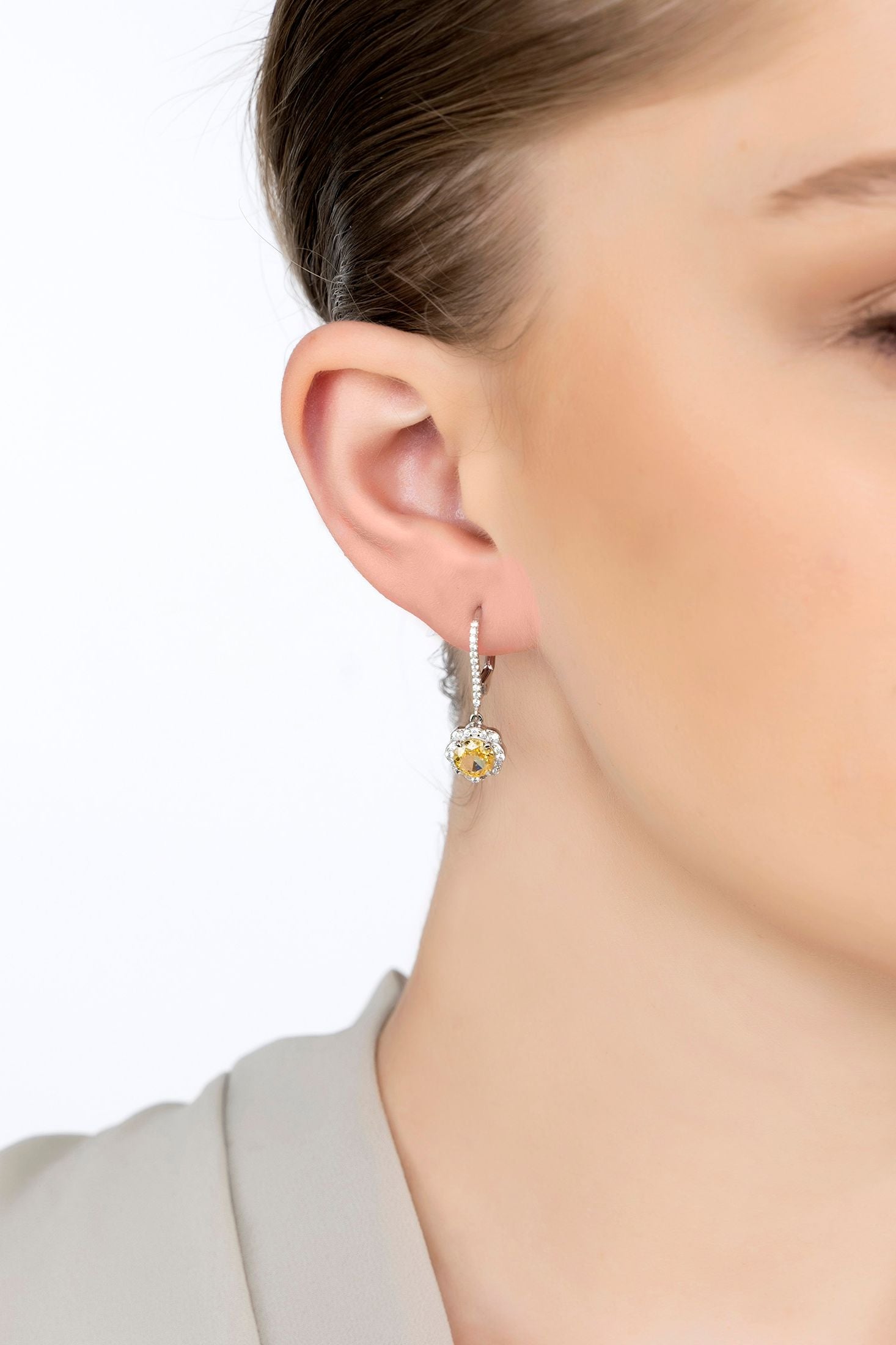 The earring worn by a model.