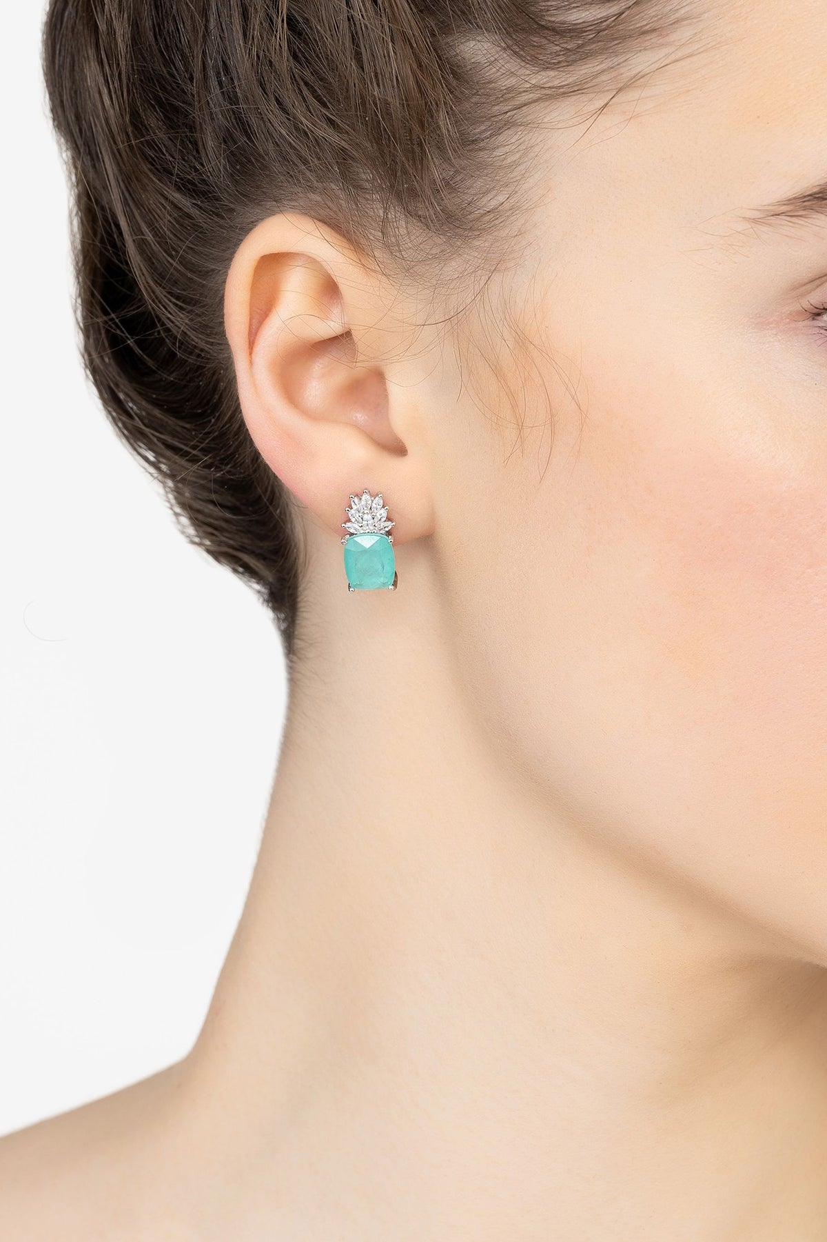 Angled view of Pineapple Gemstone Earrings Paraiba Tourmaline Silver, showing silver finish and the jewellery profile.