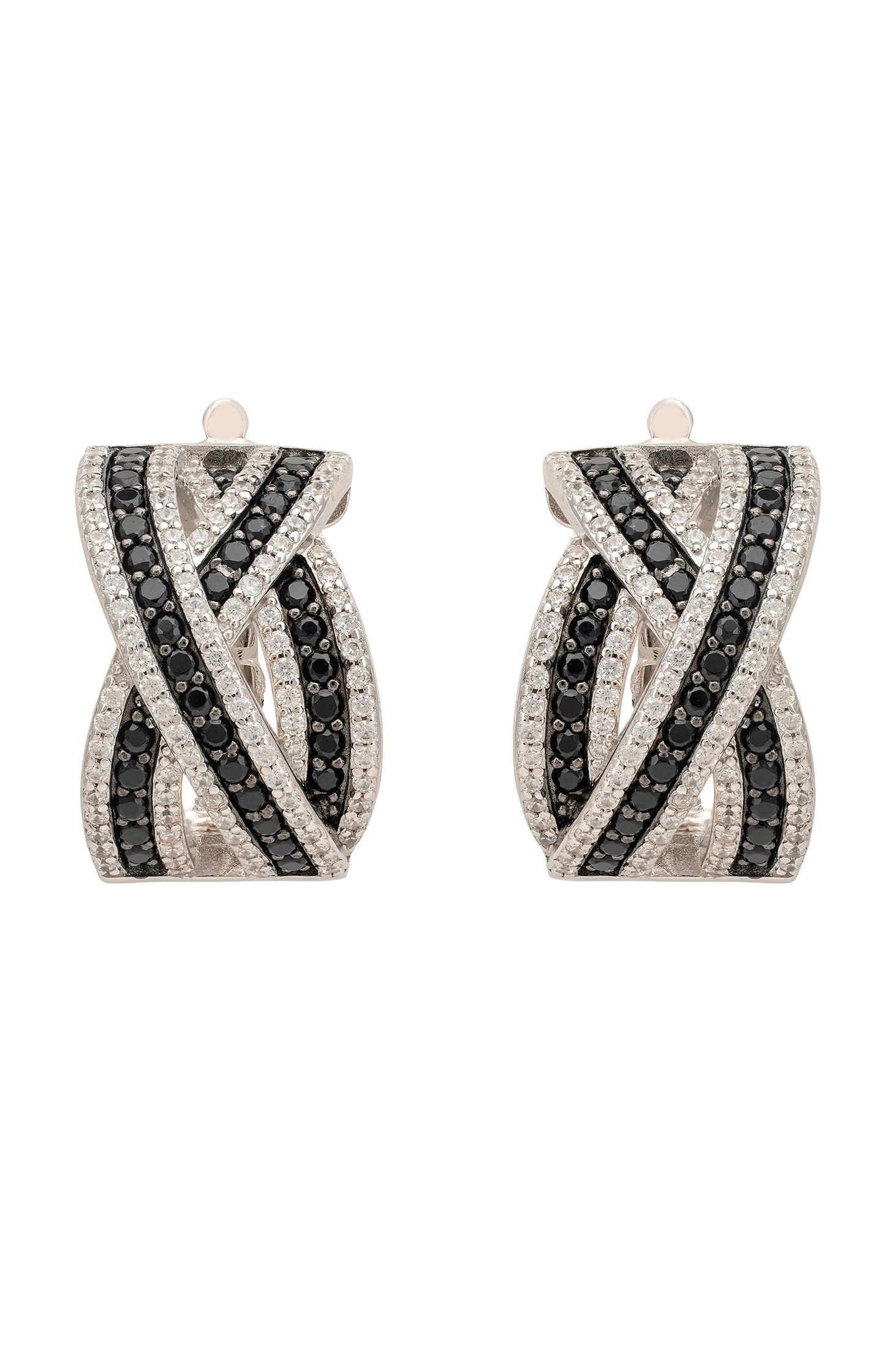 Pair of earrings with black and white gemstones on a white background