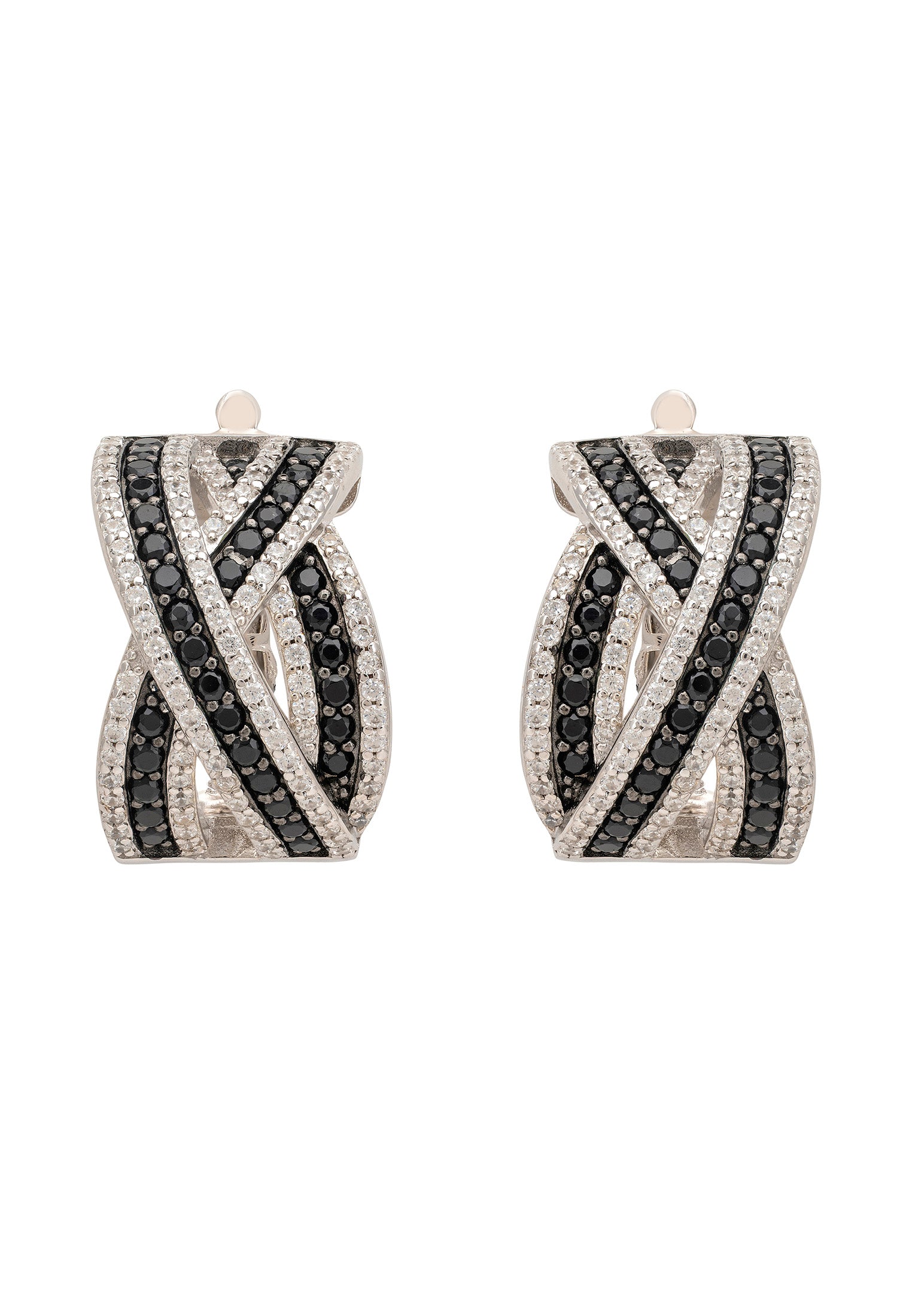 Pair of earrings with black and white gemstones on a white background