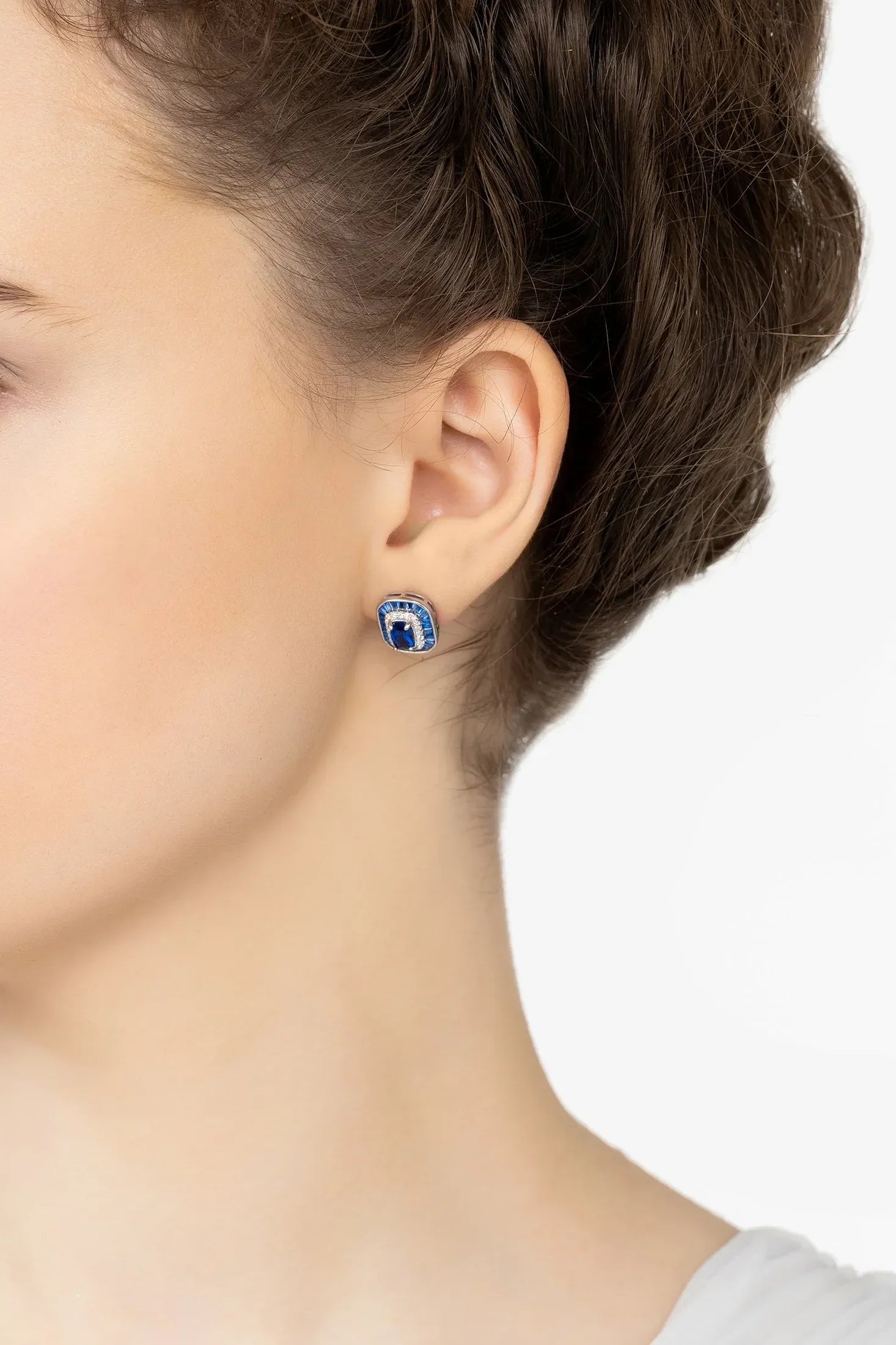 Angled view of Great Gatsby Stud Earrings Sapphire Silver, showing sapphire detailing, silver finish and the jewellery profile.