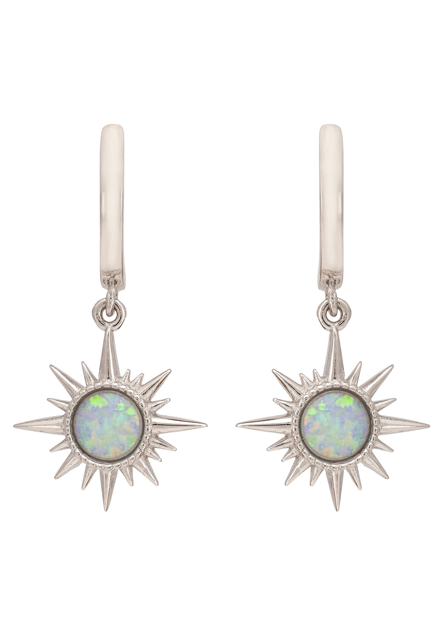 Silver earrings with star designs and opal stones on a white background