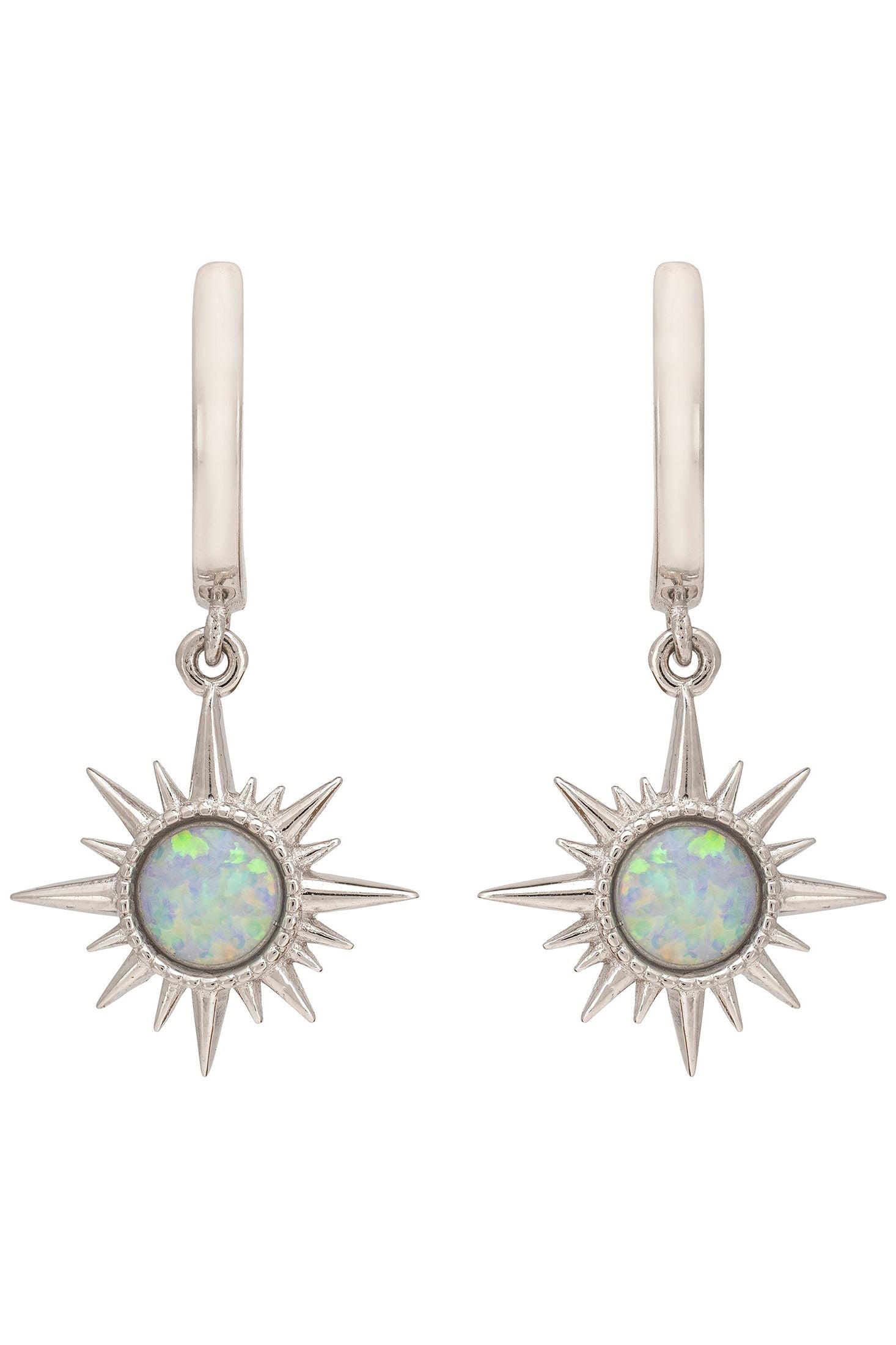 Silver earrings with star designs and opal stones on a white background