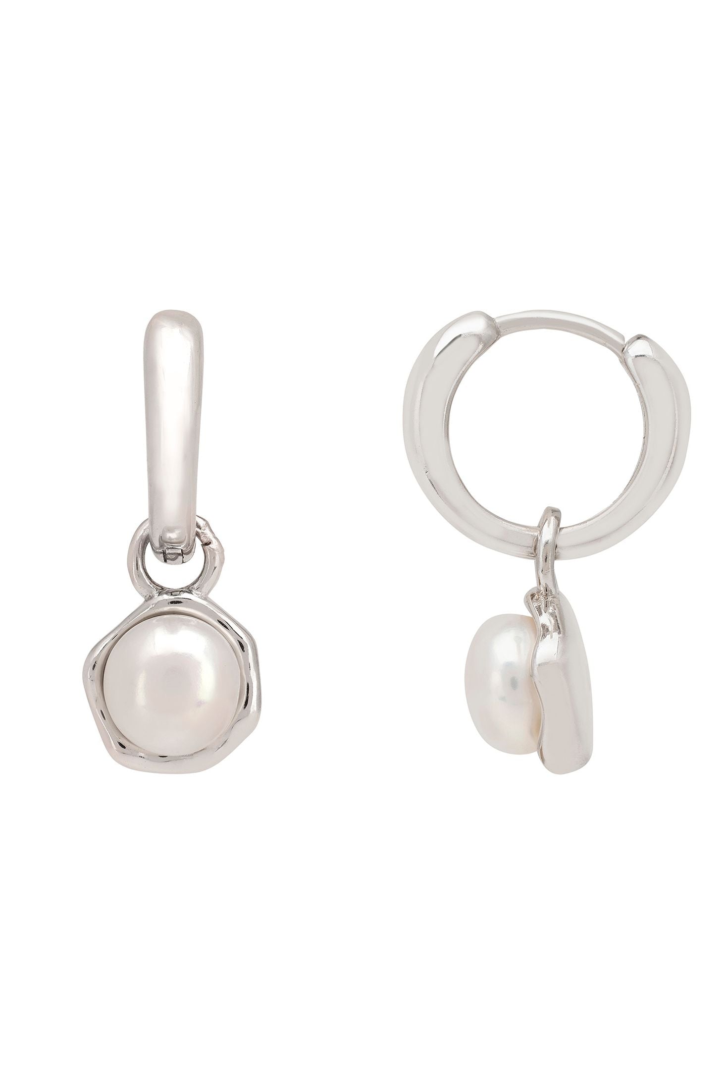 Silver earrings with pearls on a white background