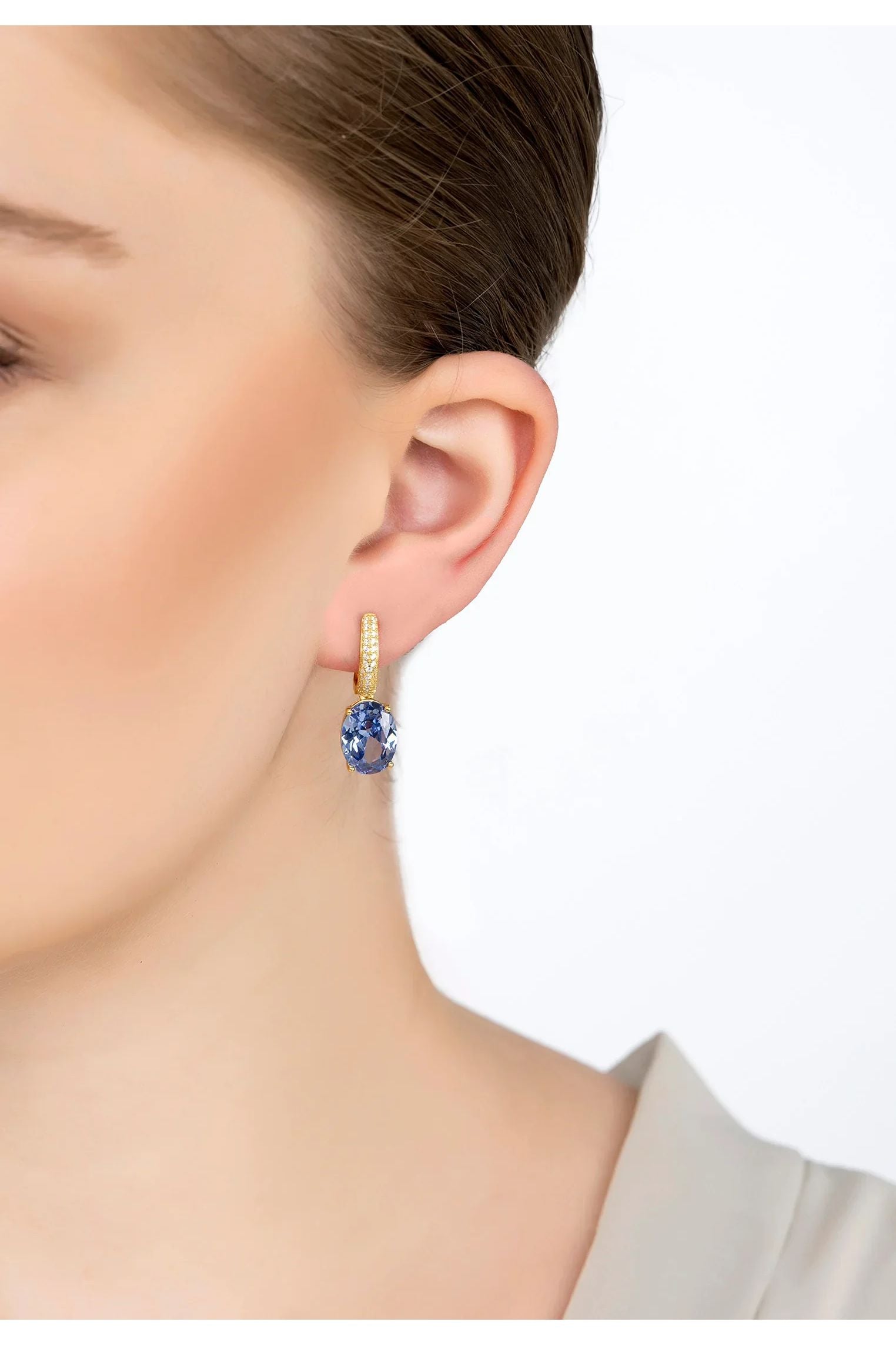 The earring worn by a model.