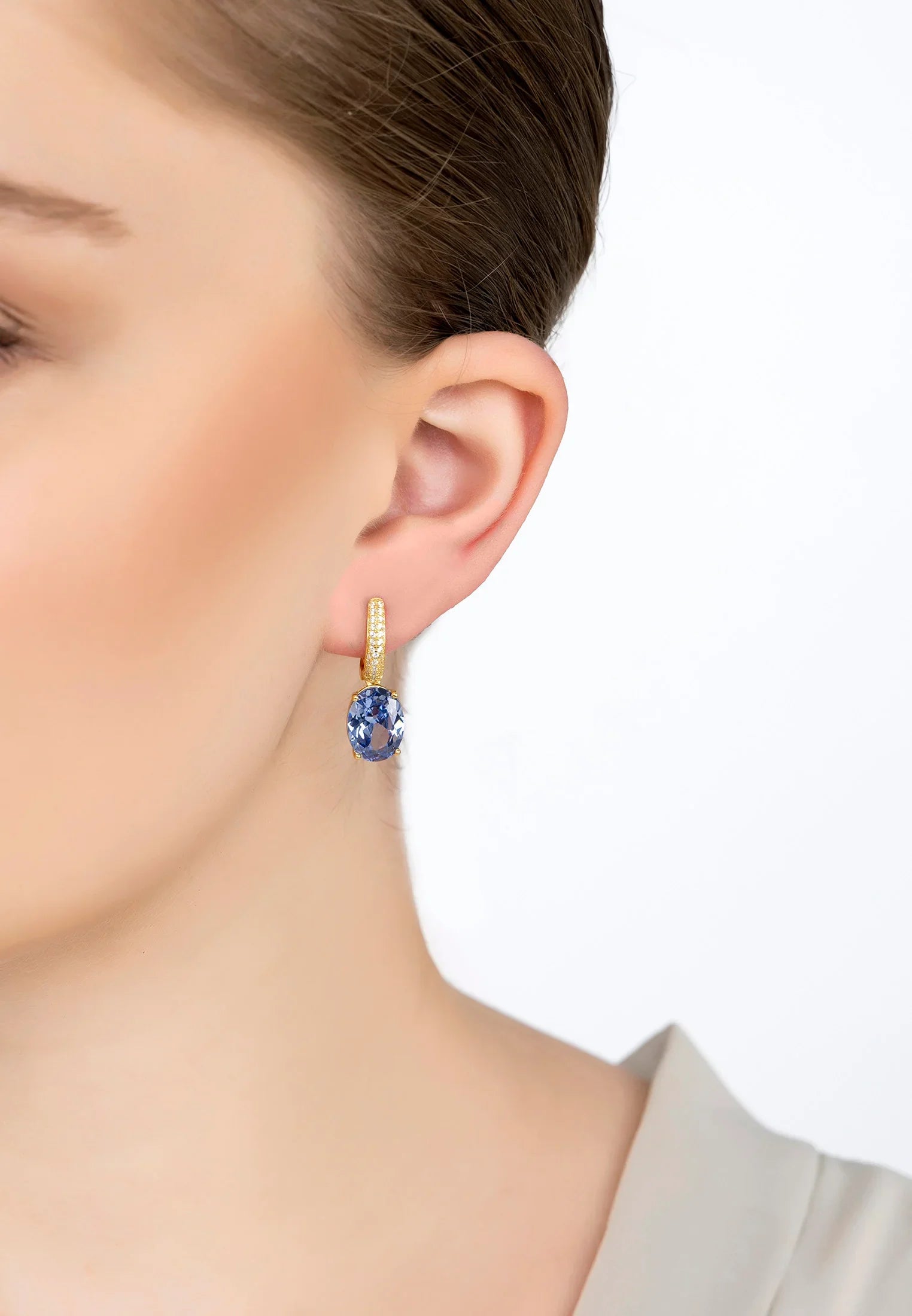 The earring worn by a model.