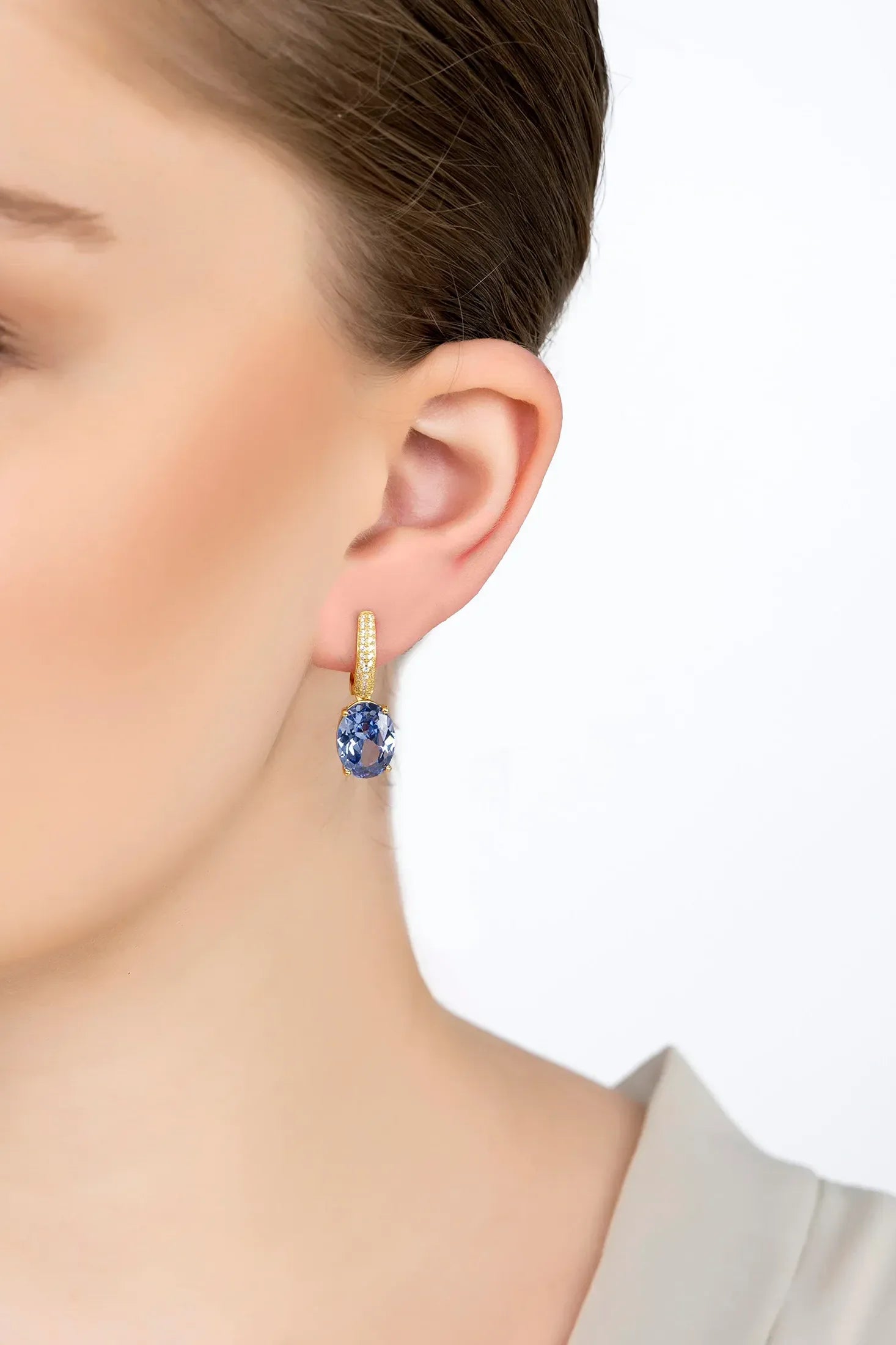 The earring worn by a model.