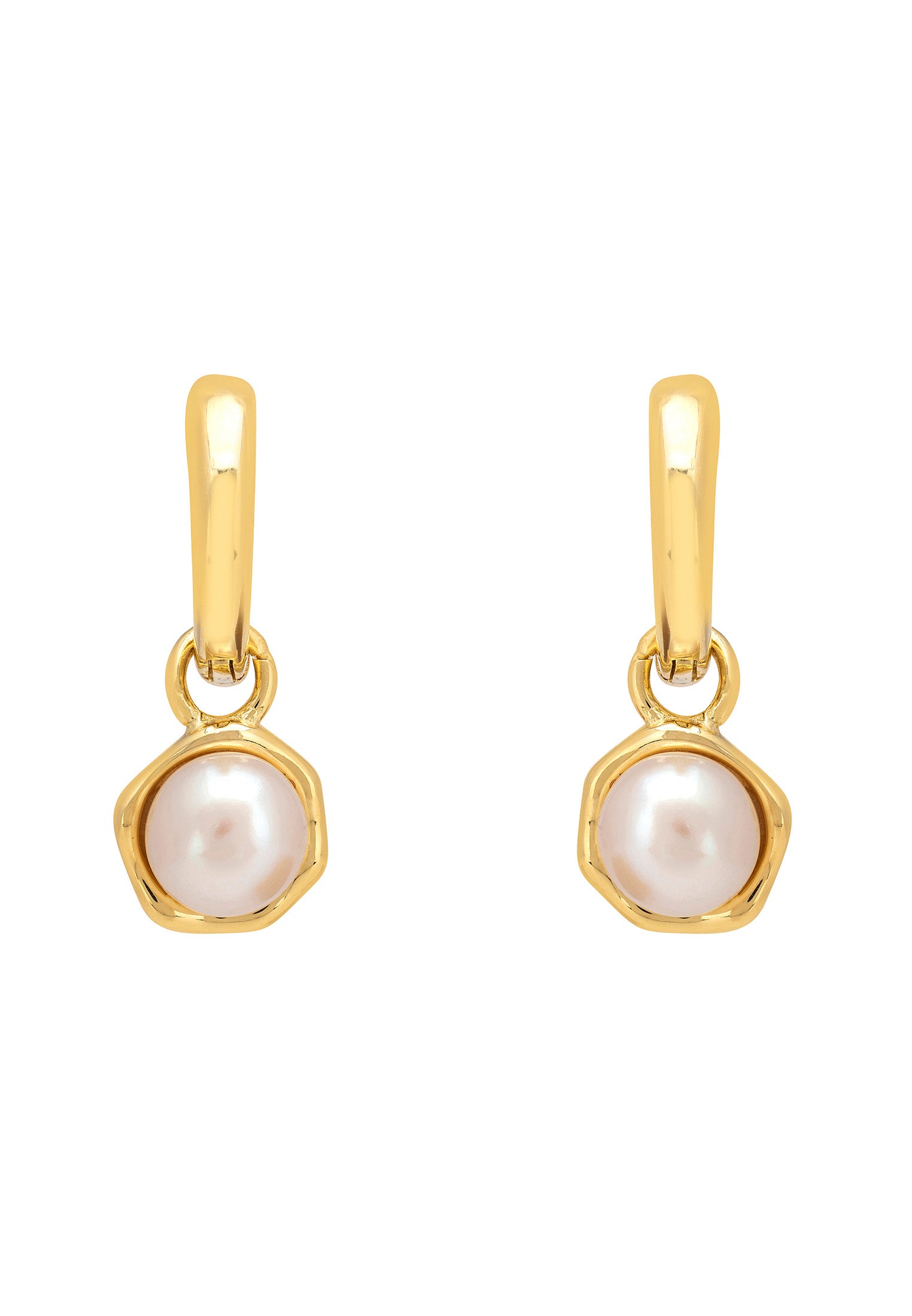 Gold earrings with pearl drops on a white background