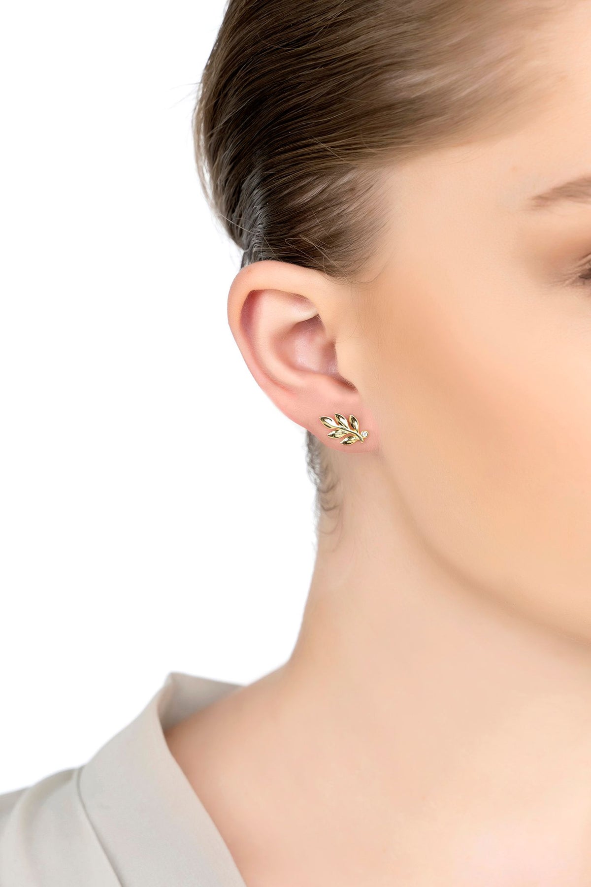 The earring worn by a model.