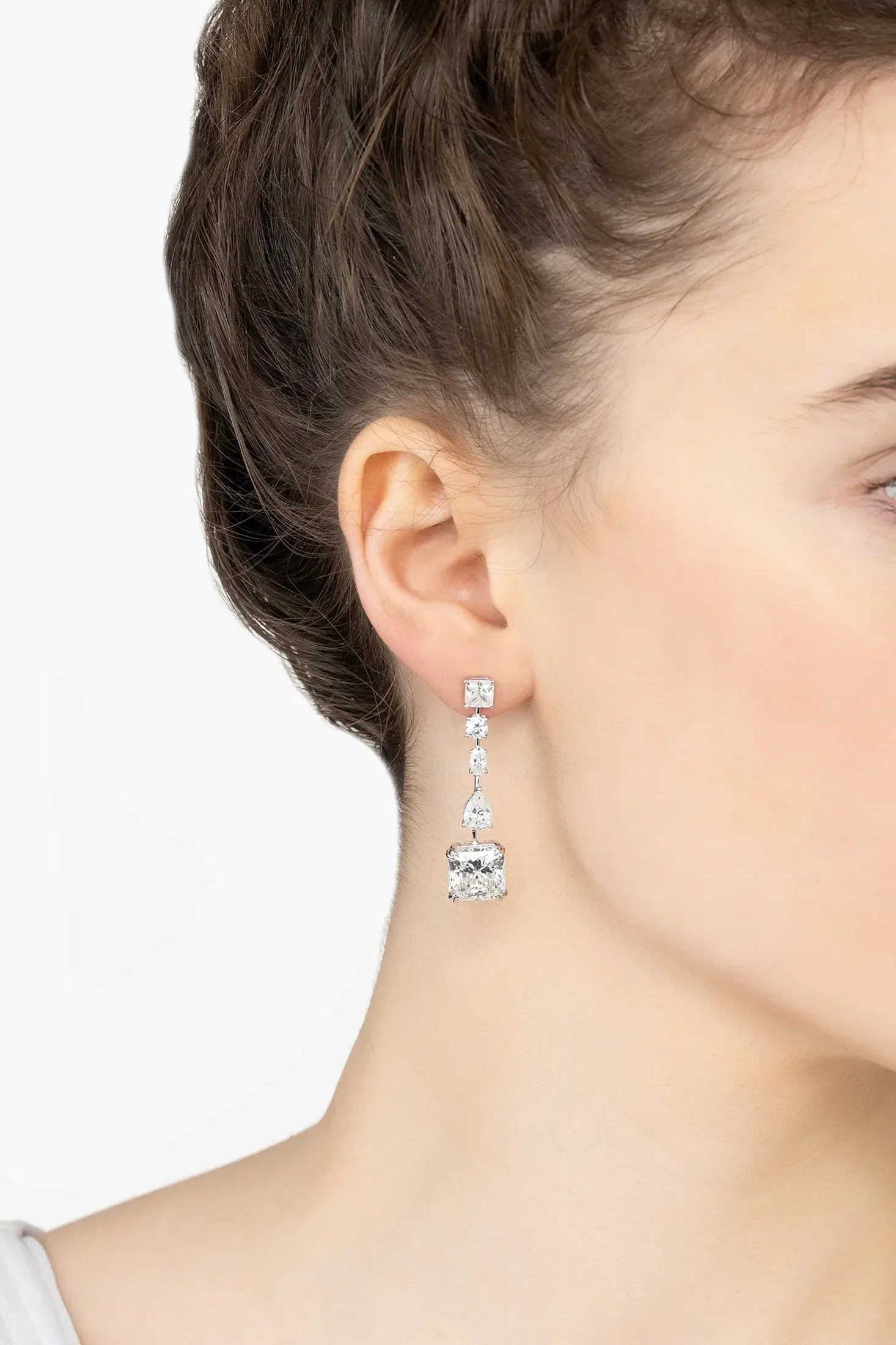 Angled view of Angelina Moissanite Drop Earrings Silver, showing silver finish and the jewellery profile.