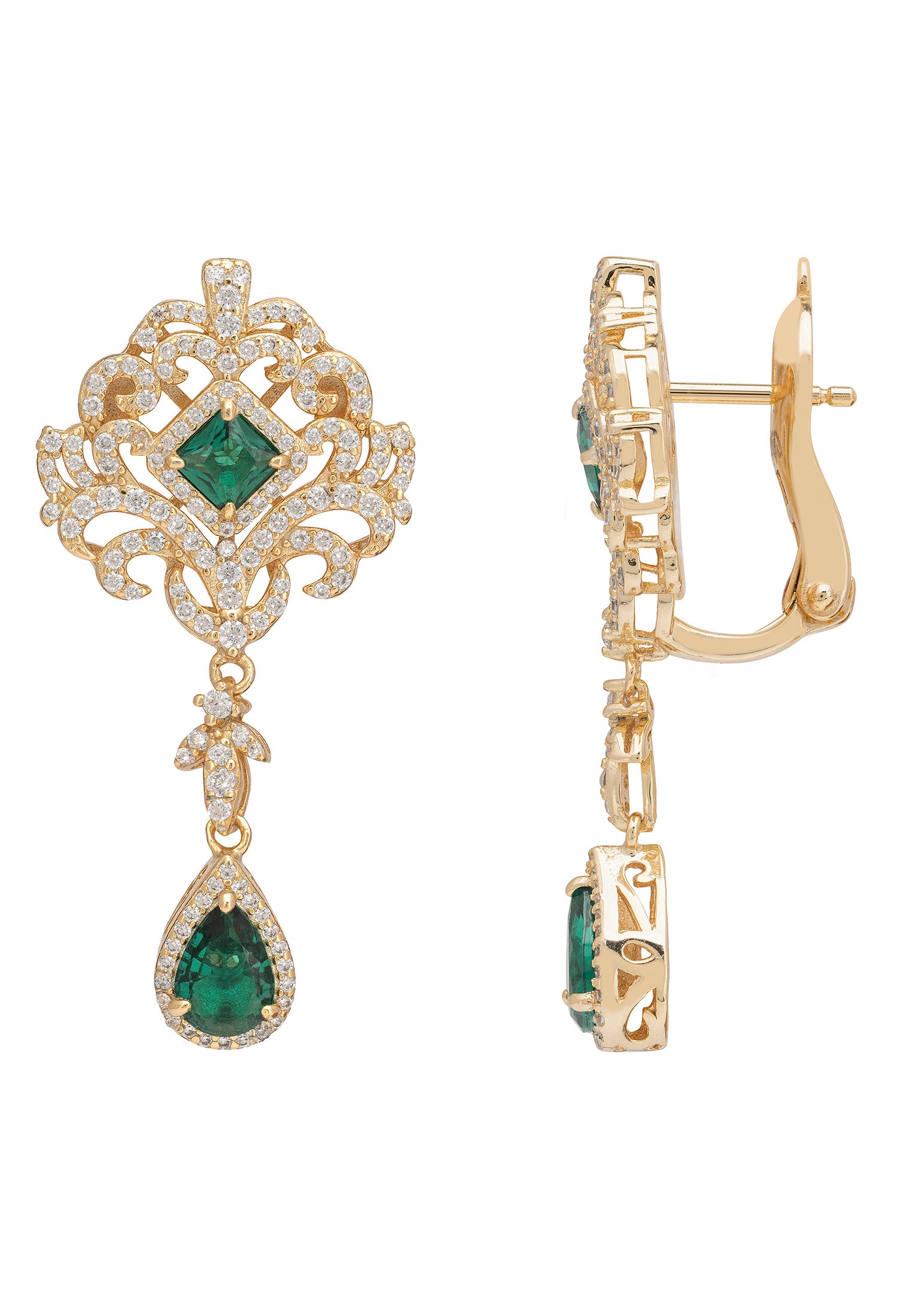 Gold earrings with green gemstones on a white background
