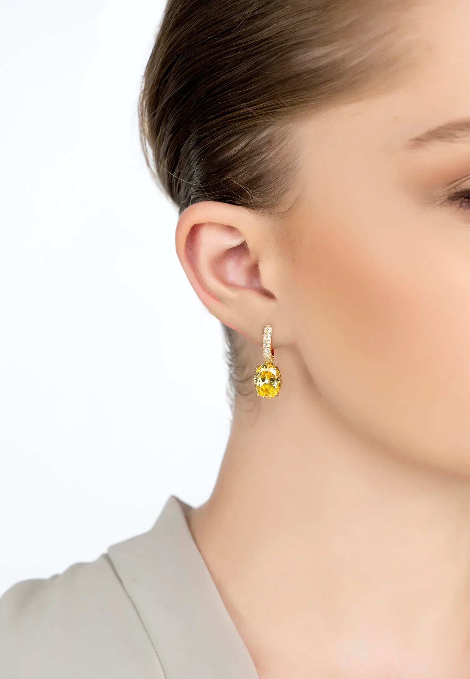The earring worn by a model.
